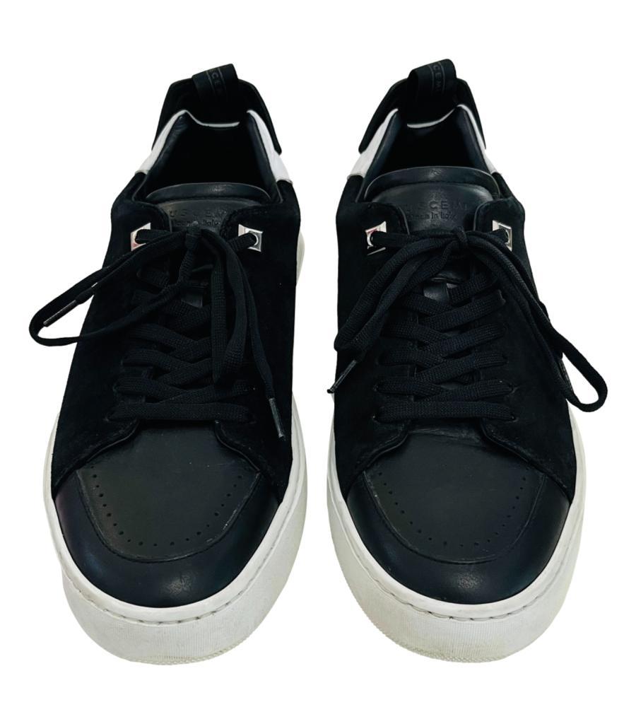 Buscemi Leather & Suede Sneakers

Black lace-up sneakers designed with suede inserts to the sides.

Featuring round toe, contrasting white leather detailing, pull tabs and wide rubber soles.

Size – 41

Condition – Good/Very Good (General signs of