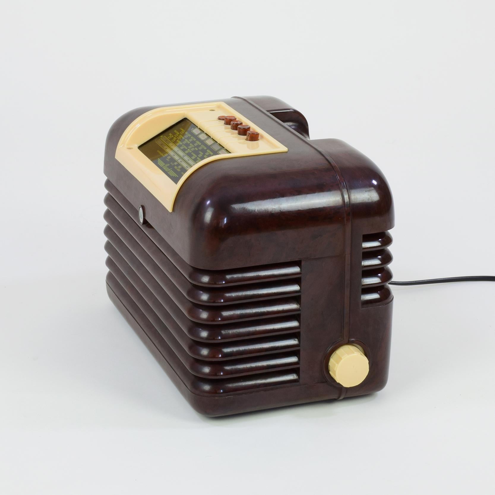 Bush Radio (manufacturer), UK

DAC10 tabletop MW and LW radio, designed, 1950, manufactured from 1950 to about 1957.

Bakelite case. Push-button and manual tuning. Mains 200-250 V, and can also work on 110 V (US) with a transformer.

A good