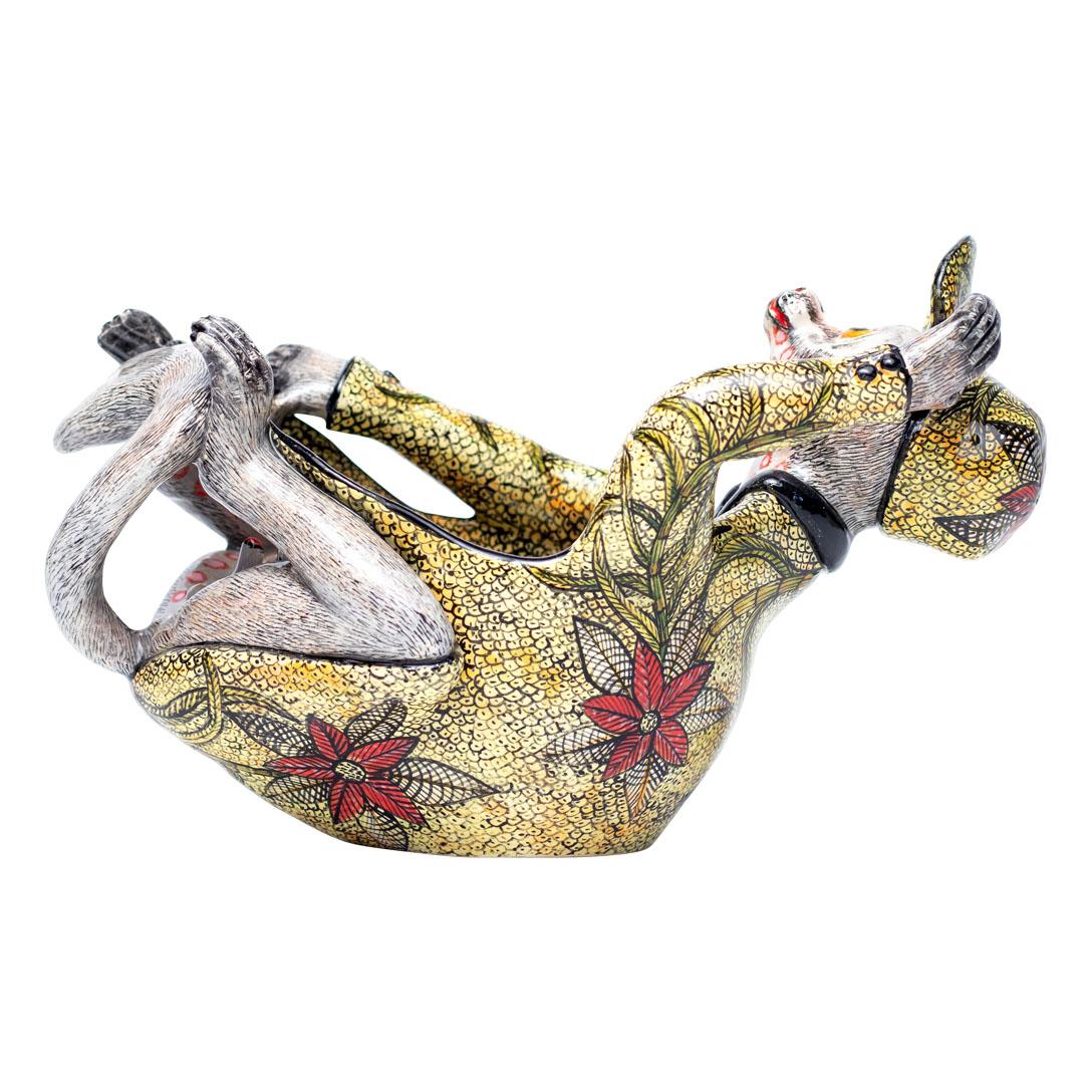 Bushbaby Peanut Bowl
Hand Painted by Winnie Mchunu and Sculpted by Sfiso Mvelase

The Bushbaby Peanut Bowl is a charming and vibrant piece of ceramic decorative art crafted by the talented duo, Winnie Mchunu and Sfiso Mvelase, from Love Art Ceramic