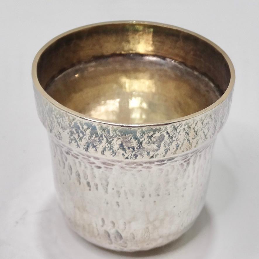 This Buccellati 1970s sterling silver shot glass is begging to be added to your barware collection! A classic shot glass has a vintage twist with this beautiful textured sterling silver. This is the perfect touch of vintage to add your bar set up!