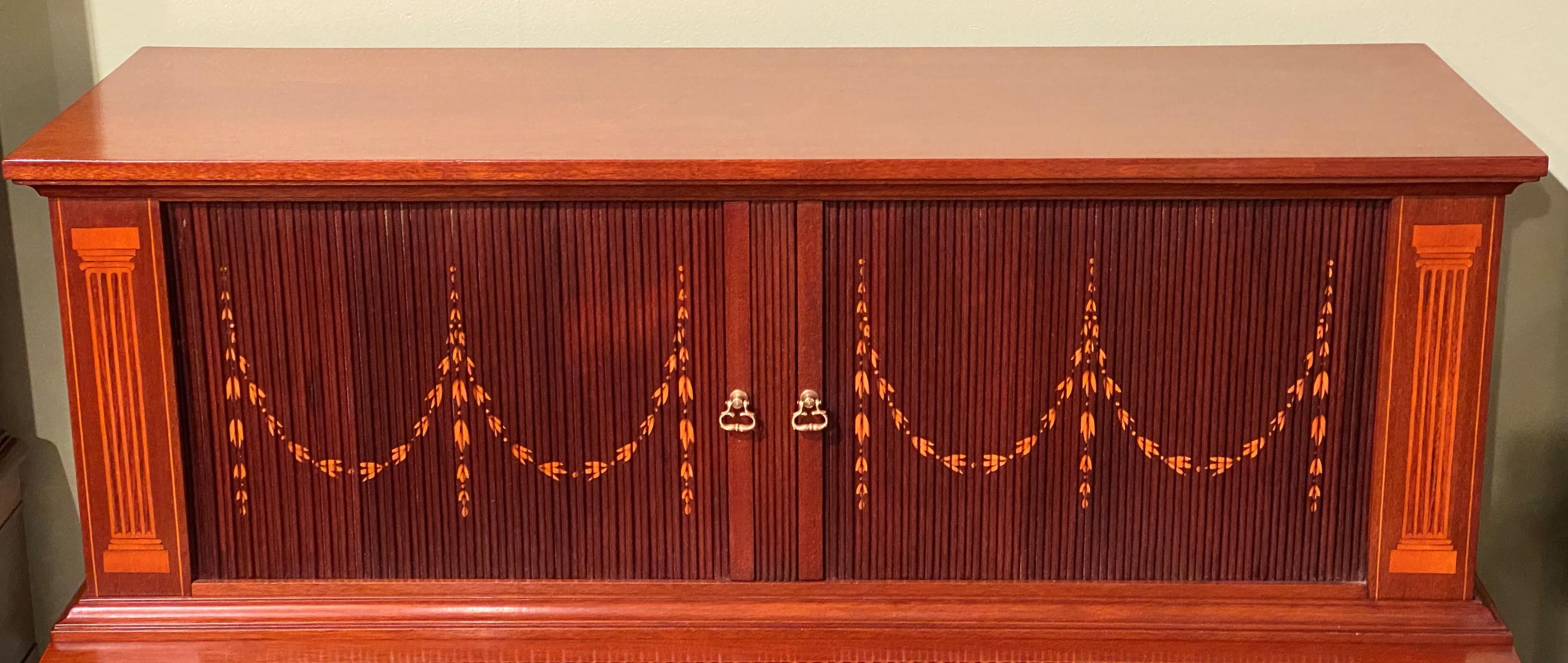 A fine custom mahogany two piece tambour desk in the manner of Boston cabinetmakers John and Thomas Seymour by Bussolini Brothers of West Quincy, Massachusetts featuring an upper case with two tambour doors with satinwood swag inlay, opening to a