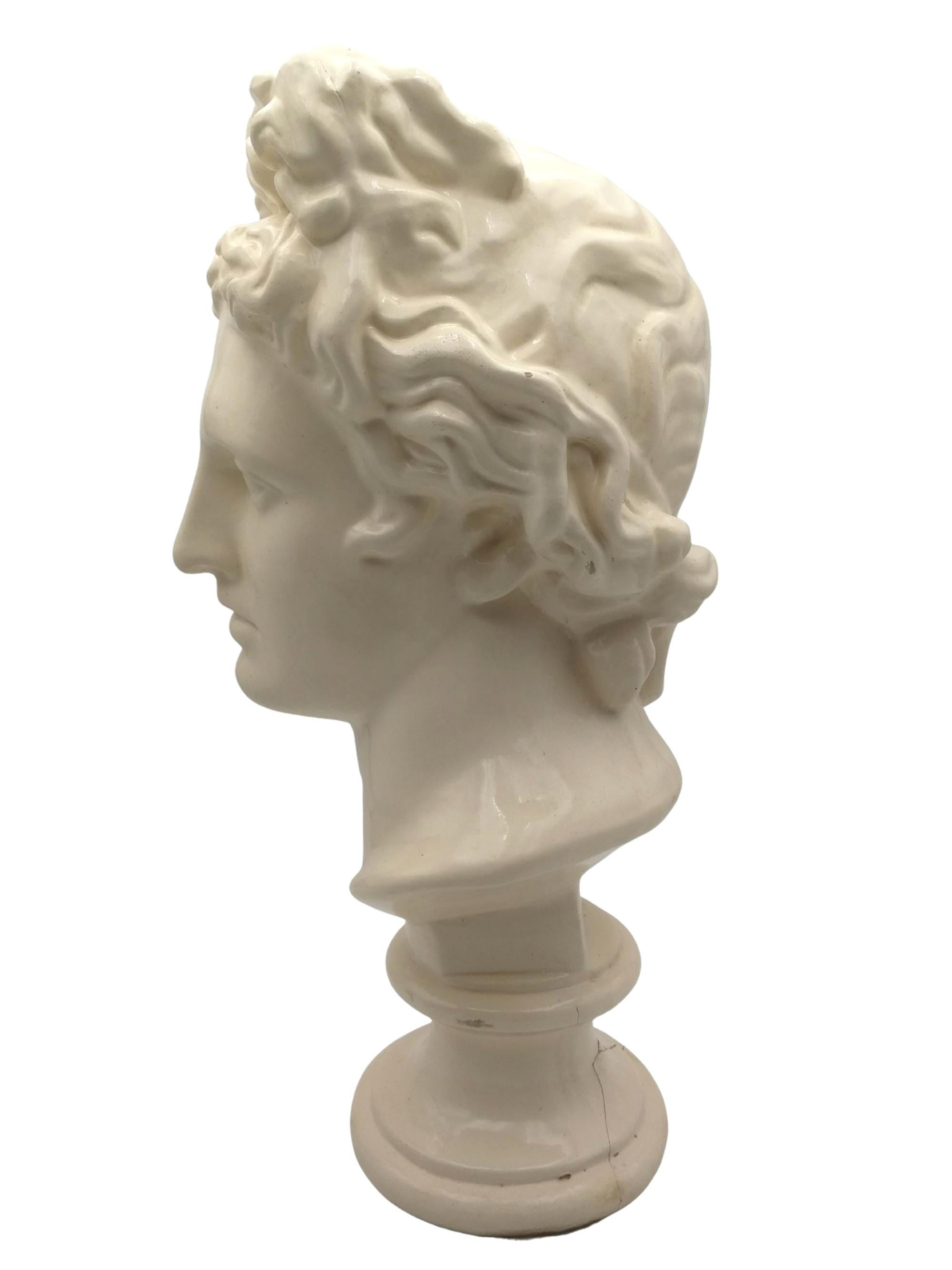Beautiful glazed terracotta bust of Apollon. This beautiful and elegant off-white bust made in Spain around the 50’s will be a prominent element of your decoration.

