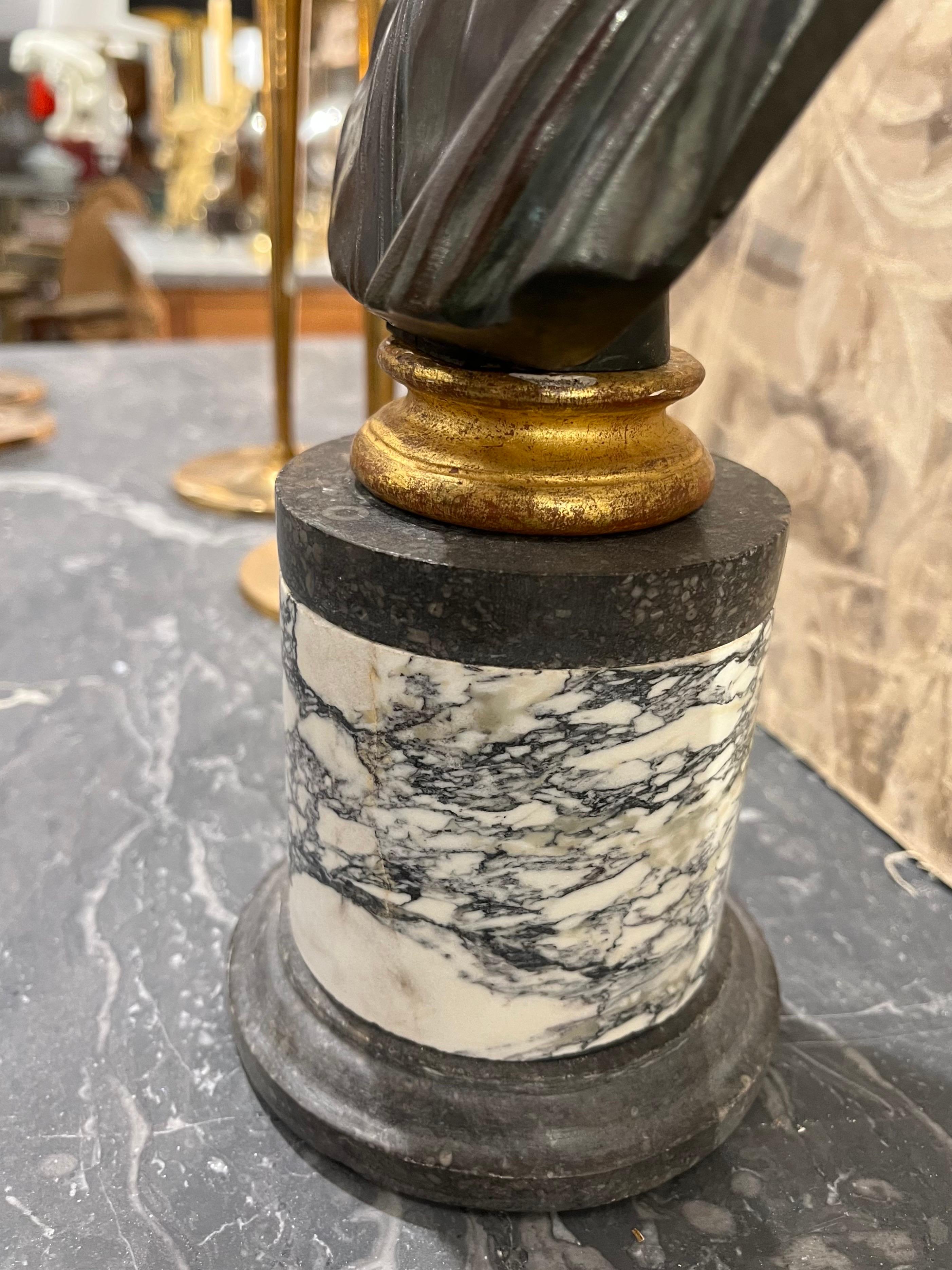 A 19th century patinated bronze depicting the hero Ajax or Menelaus, king of Sparta, mounted on a column-shaped base of grey veined marble, a classic souvenir of the Grand Tour