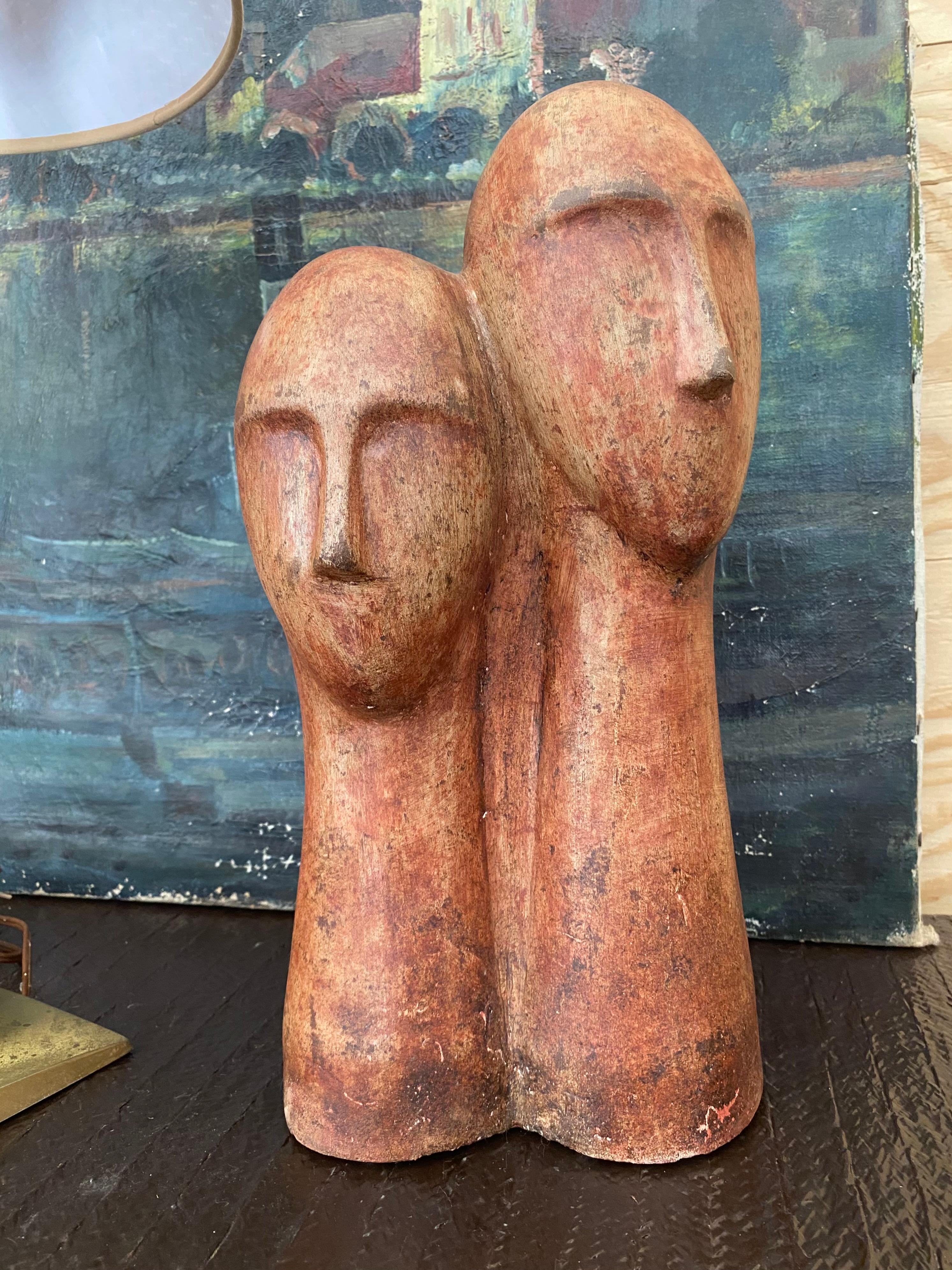 An Amedeo Modigliani-inspired terra cotta bust featuring two Minimalist figures. Wonderful rust finish over entire surface; illegibly signed to base. Large-scale piece that stands 15