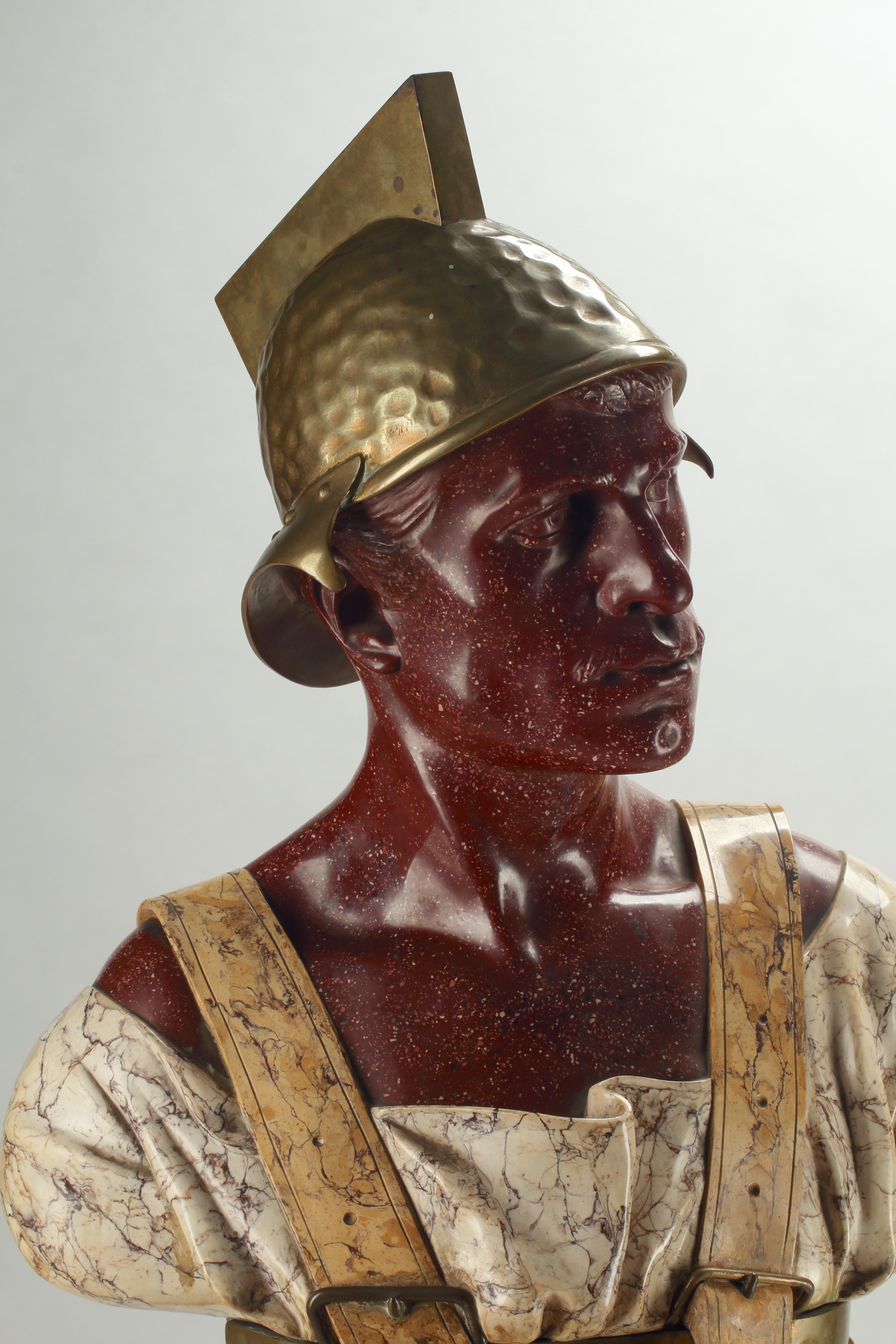This unique bust of a Roman soldier in scagliola is remarkable in its attention to detail. With nearly lifelike facial features, this soldier stands at attention sporting a hammered brass helmet and breastplate over his draping toga. The initials