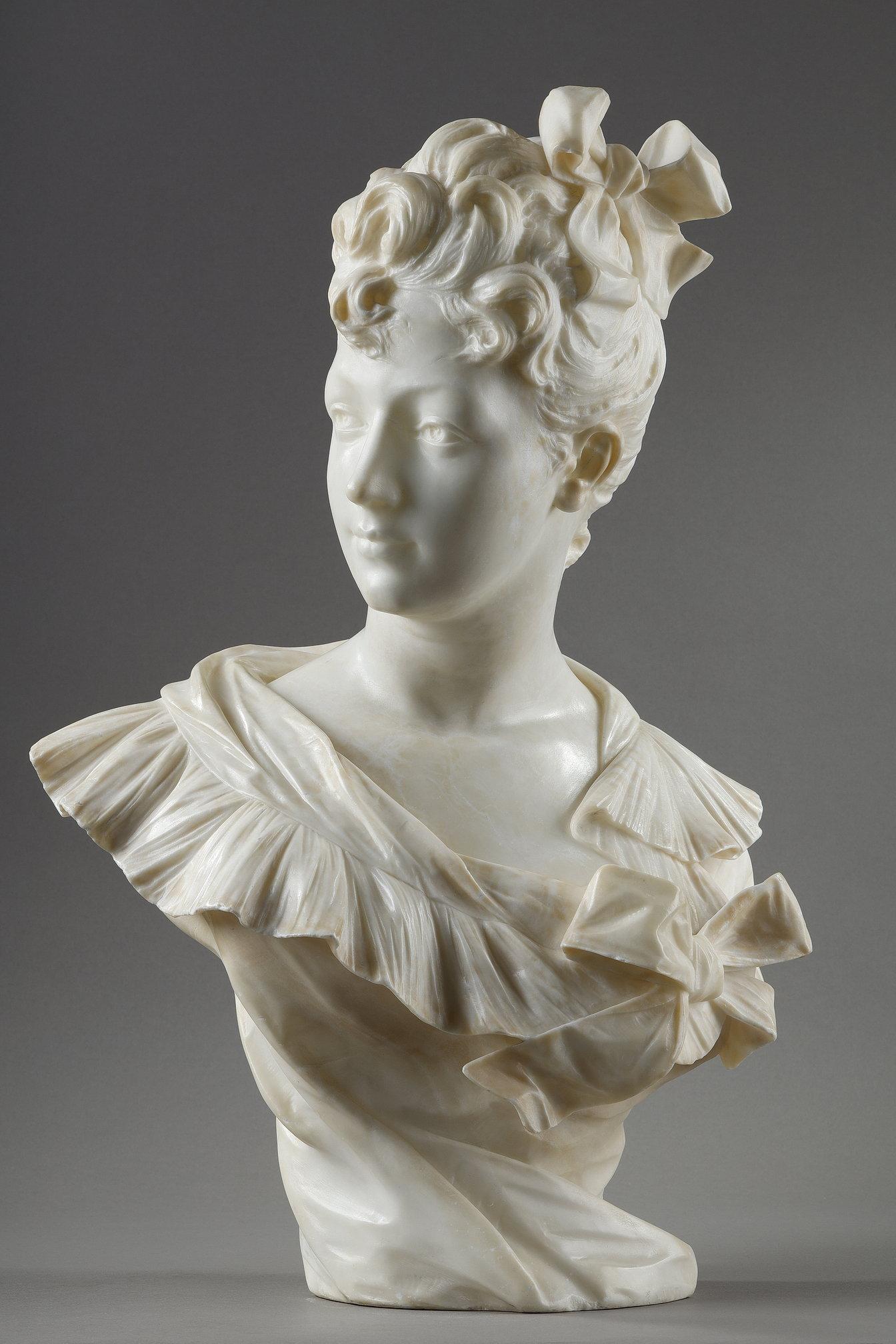 Bust of a beautiful woman in a corset held in place by a bow, with her face turned to the side exposing her profile. This beautiful marble sculpture is signed 