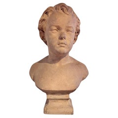 Antique Bust of a young boy with bare shoulders, signed in the style of Camille Claudel
