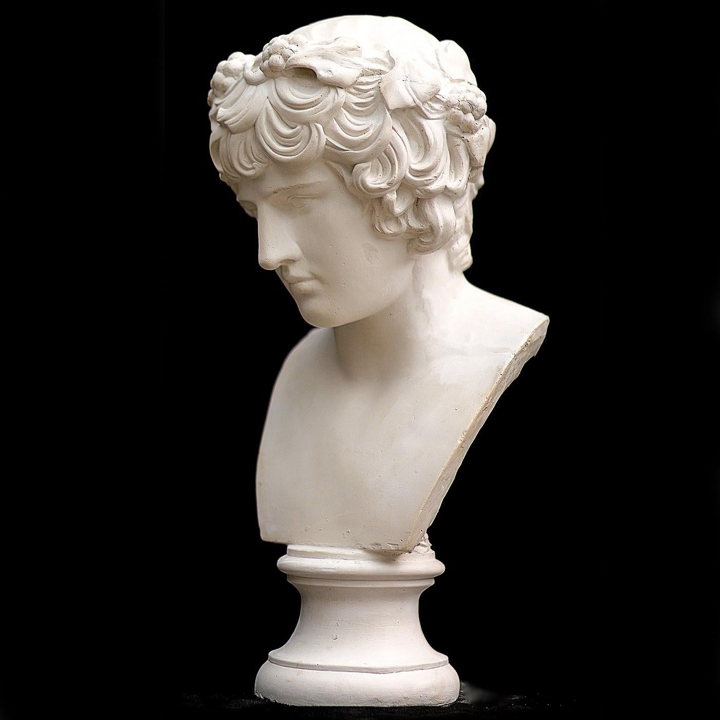 This handmade work is a reproduction of a piece currently housed in the British Museum in London. The bust of the young, Ancient Greek hero Antinous is famed for its lifelike depiction of human features, including a rounded chin; fleshy mouth; wide,
