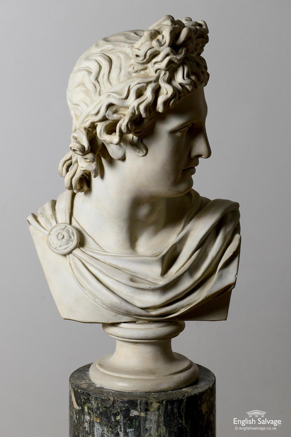 Vintage plaster bust of classical male on a Scagliola pillar. There is some damage to the base of the pillar and small surface scratches and chips throughout, commensurate with age.