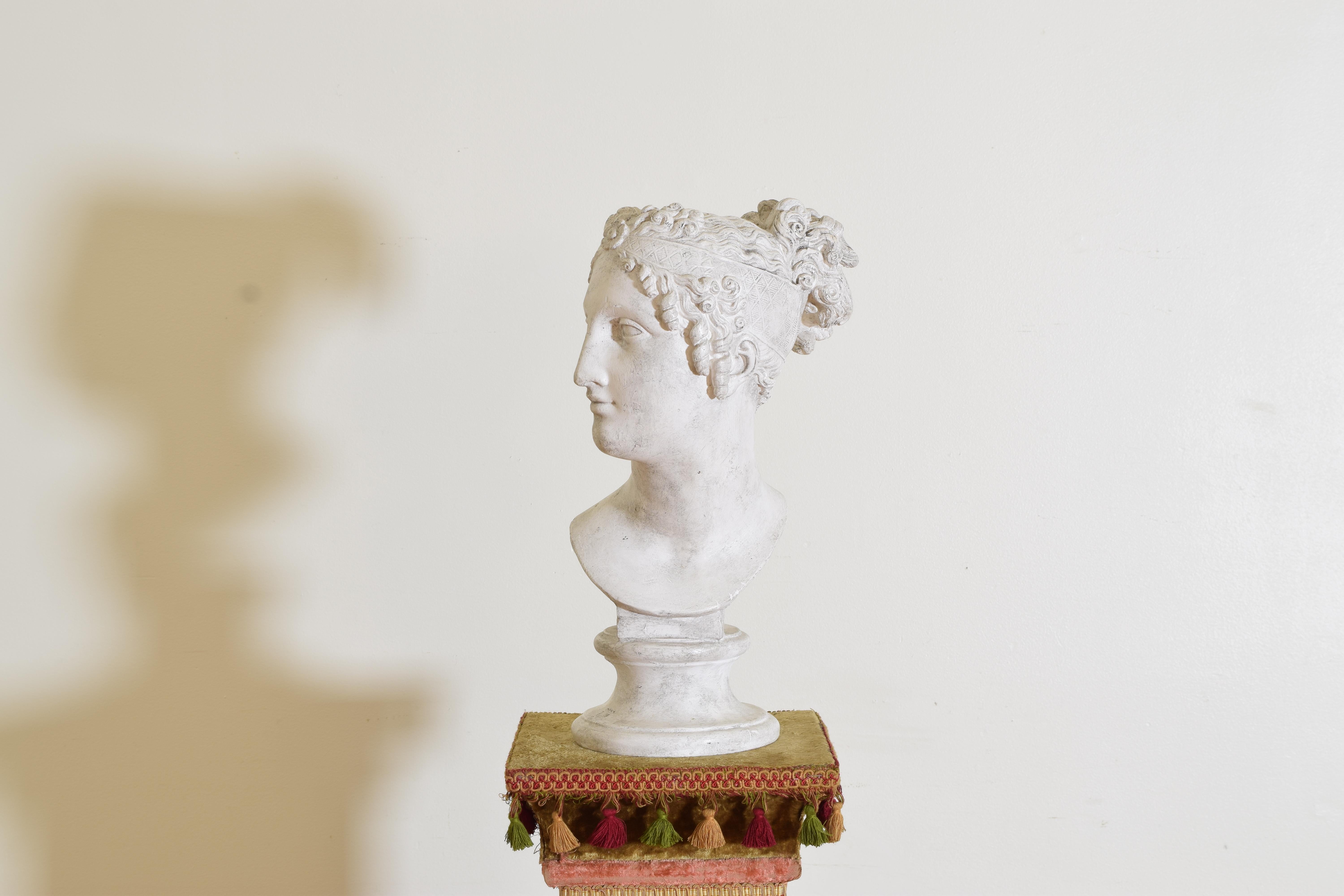 The plaster bust portrays Napoleon's sister, Pauline Bonaparte, as Venus Victorious. 
It was commissioned by her husband, Camillo Borghese, and originally sculpted in Rome from 1805 to 1808 which is on view at the Galleria Borghese in Rome. 