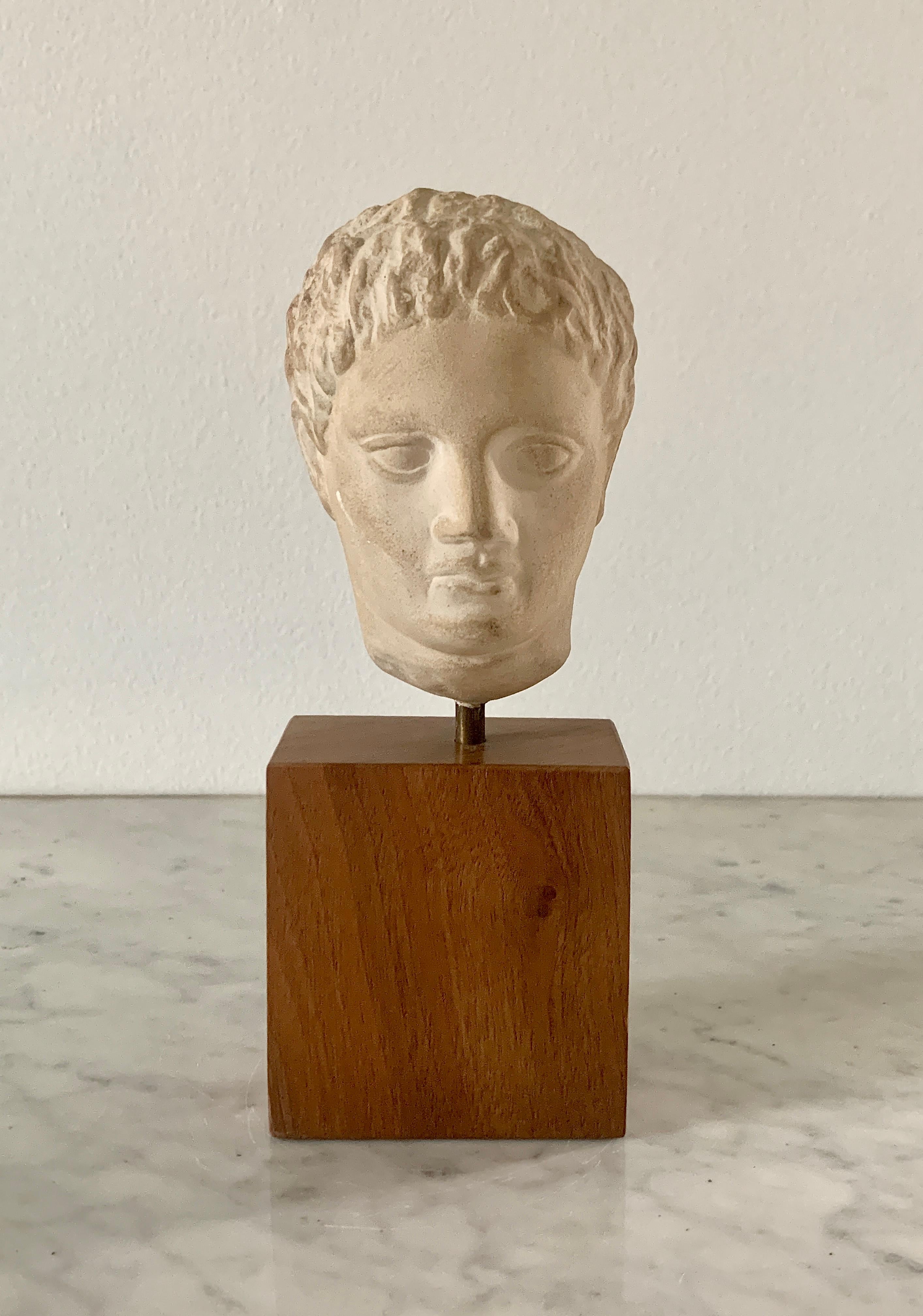 A gorgeous bust of Roman emperor Augustus.

Circa mid-20th century

Plaster bust on wood pedestal base

Measures: 2.88