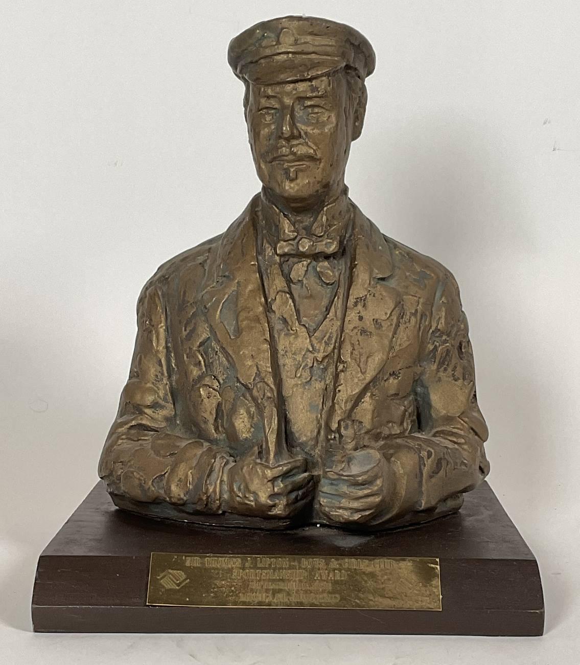 Award trophy of famous yachtsman and tea merchant Sir Thomas J Lipton. Engraved plate reads Sir Thomas J Lipton - Boys and Girls Club Sportsmanship award, Optomist Branch, Michael Moreno. The cast resin bust has a faded paint finish. Mounted to a