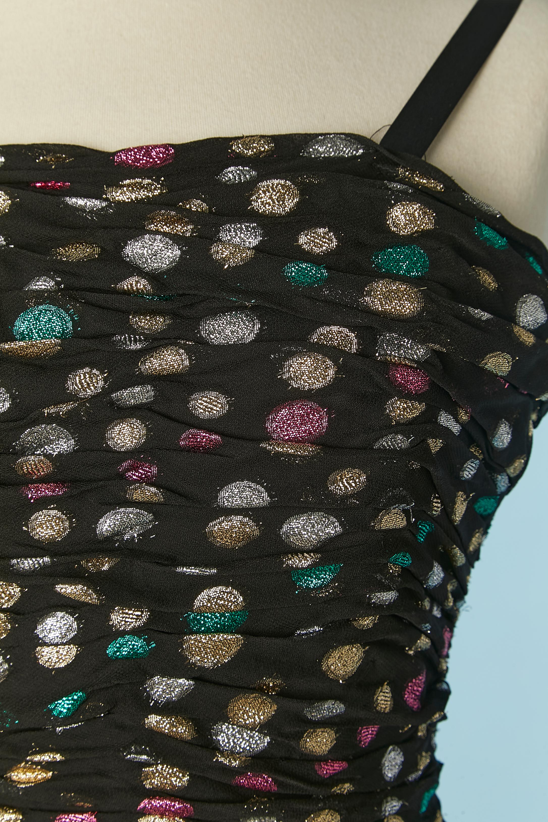 Bustier cocktail dress in Polka dots Lurex. Main fabric composition: 70% rayon, 30% lurex. Acetate lining and black tulle petticoat. 
Boned. Zip closure in the middle back. 
Size XS but the bust has been altered and it's possible to enlarge it again