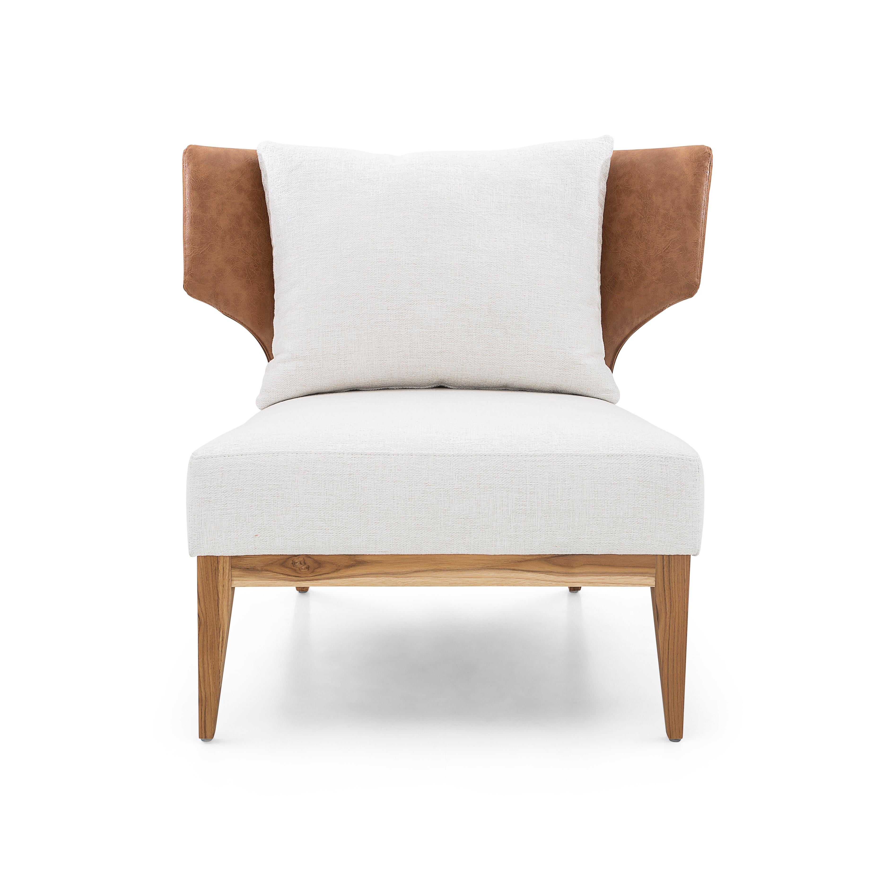 The Busto Curved Back Armchair is the perfect combination of a light brown faux leather on the outside and inside of the back, an off white beautiful and soft fabric seat and back pillow, and wood legs in a teak finish to match with this