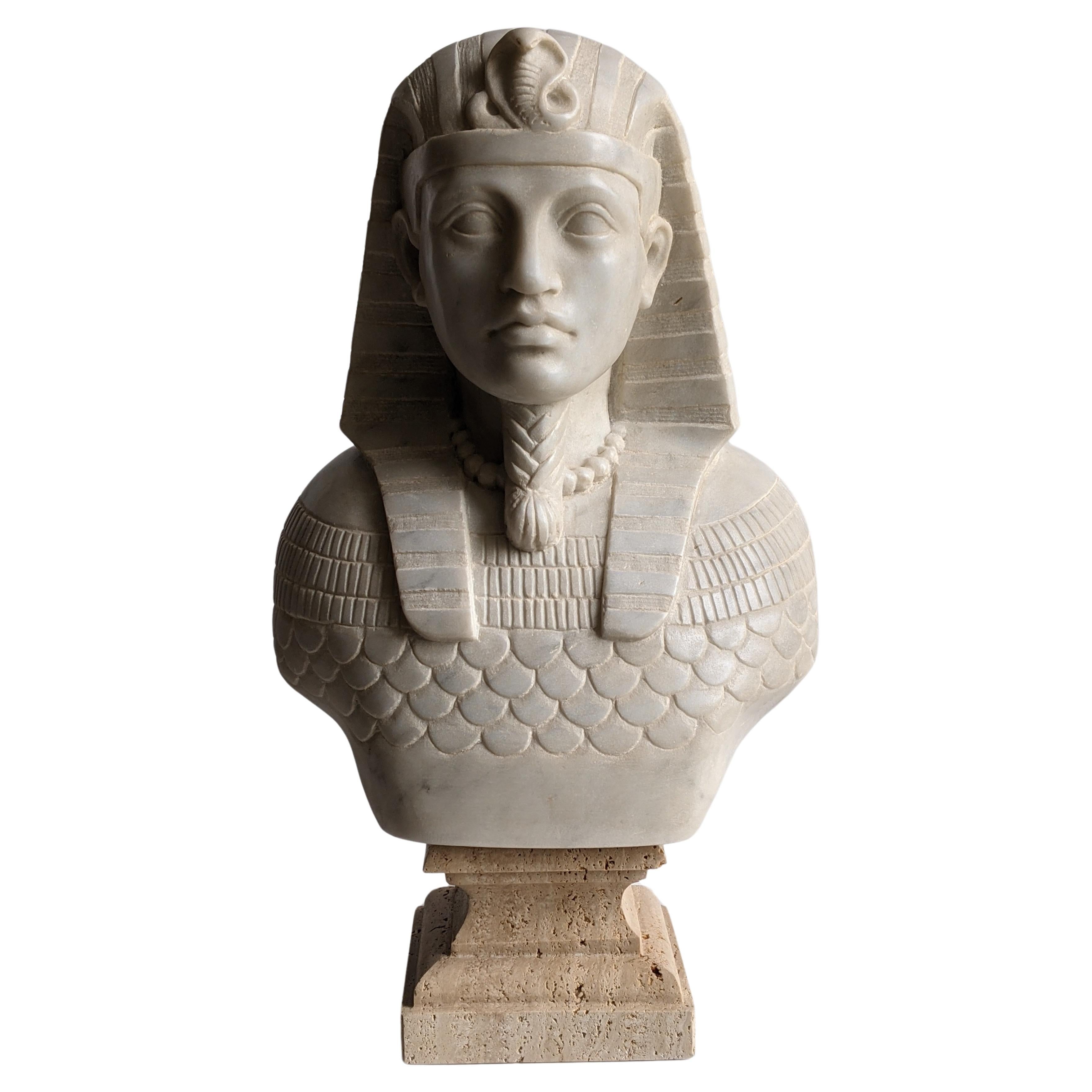 Bust of Egyptian pharaoh carved on white Carrara marble