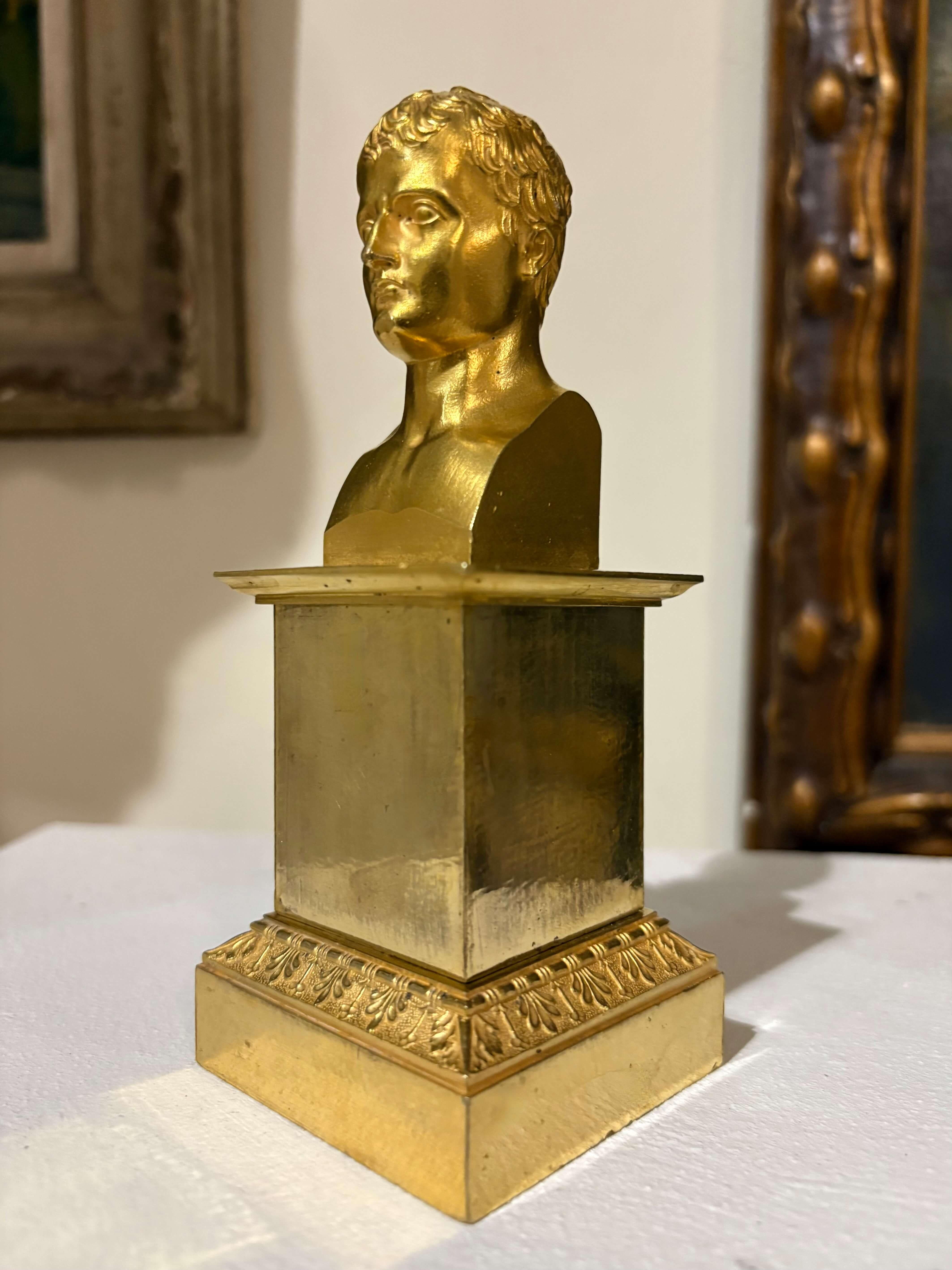 Bust of Emperor Napoleon I in gilded bronze  empire-era, early 19th century. Small in size, it belongs to those delightful Napoleonic historical souvenirs. The gilding, mercury gilding is original and in excellent condition. The bust is signed and