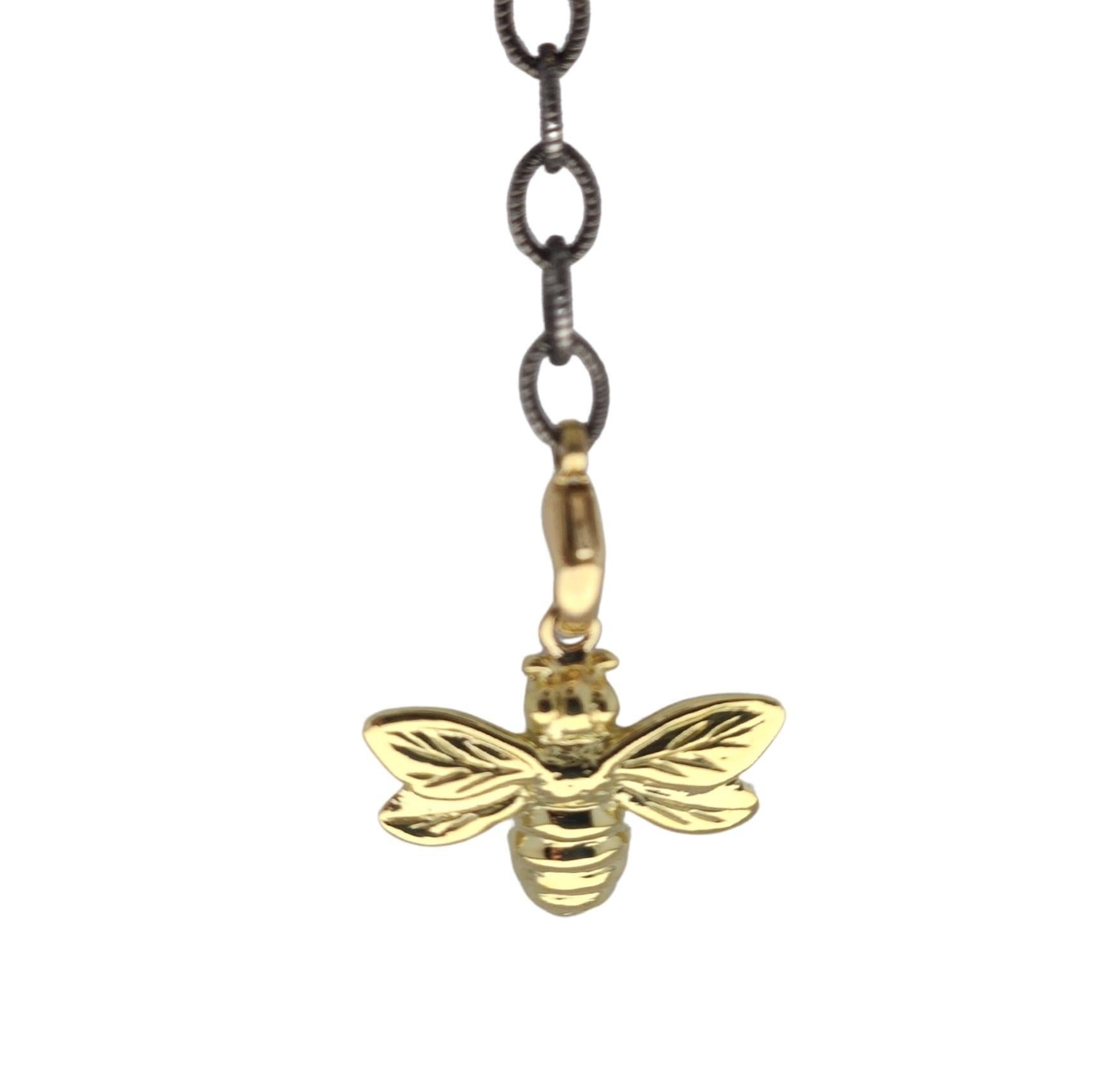 Alison Nagasue's deep love for Nature inspired her to create a high polished realistic 18K Bee that can be worn in many versatile ways off the oxidized silver chain with two 18K lobster clasps. Shown as a lariat, the bee can also be a pendant since