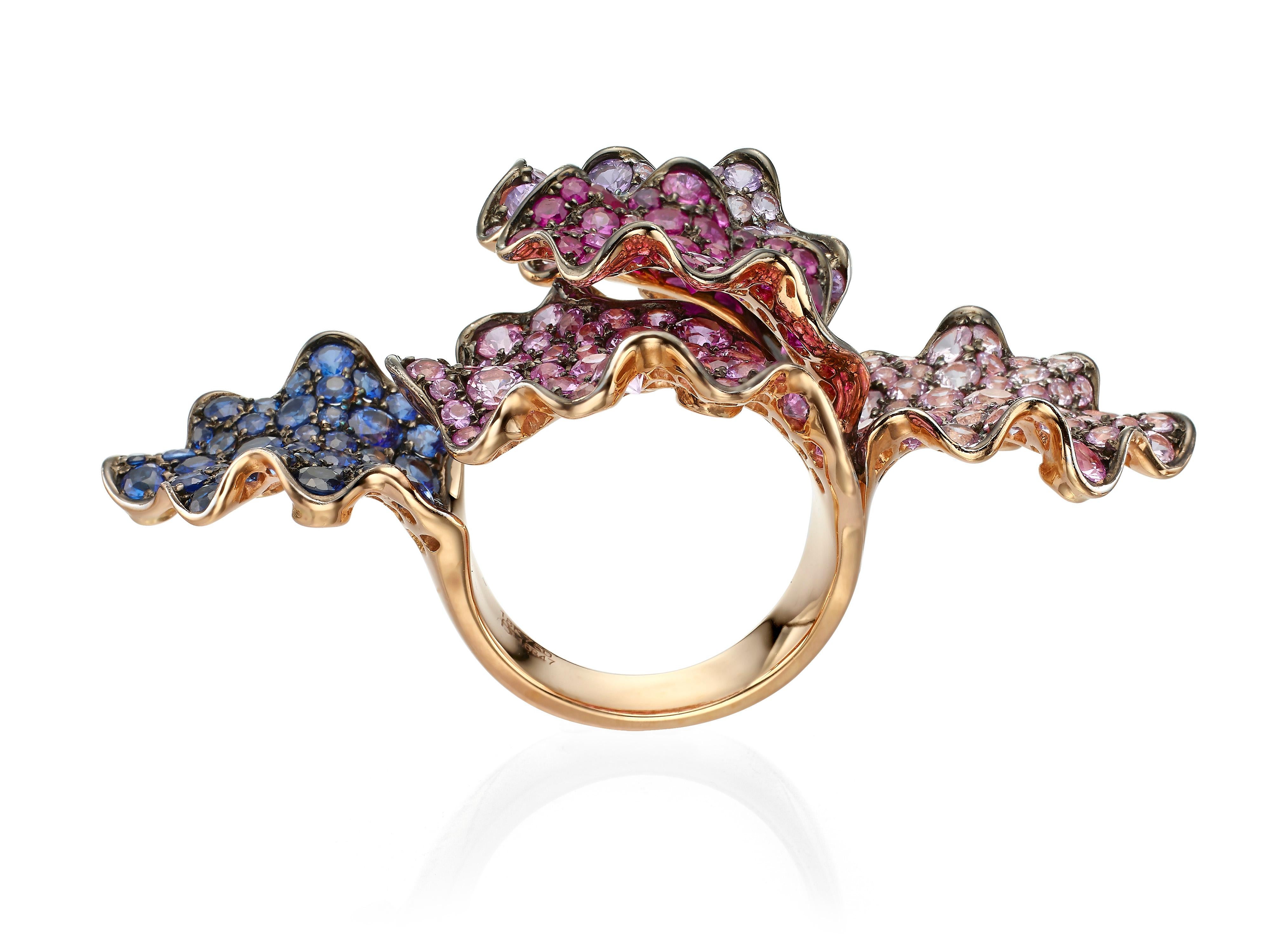 This enchanting multi-color sapphire and ruby cocktail ring adds the perfect finishing touch to any ensemble.  Handmade from 18K rose gold with 8.71 carats of pink, blue and purple sapphires and 2.02 carats of rubies.  Currently a ring size US 7. 