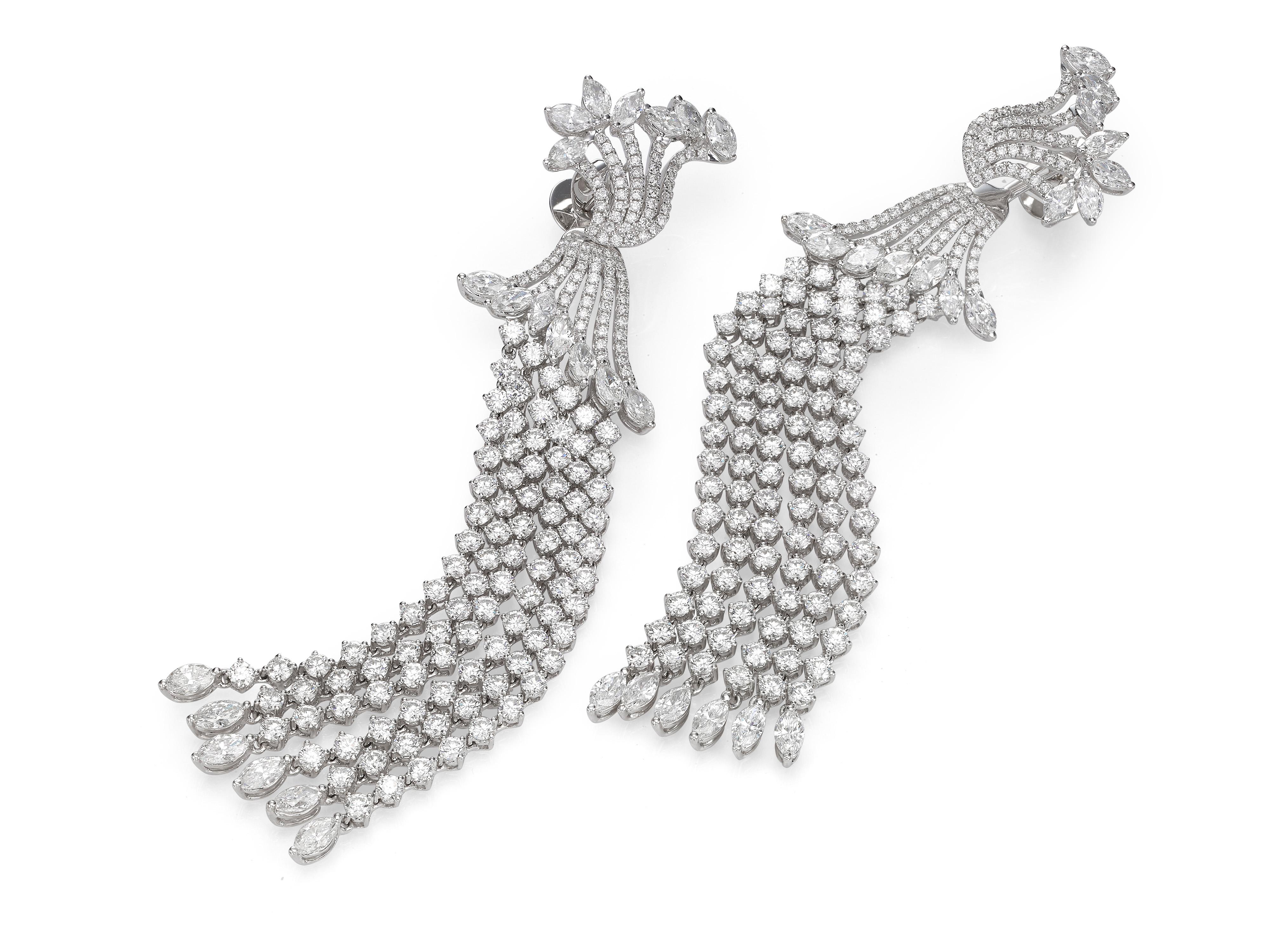 This pair of Butani diamond chandelier tassel earrings feature an ornate floral design encrusted with round brilliant-cut and marquise diamonds.  Skillfully made in 18K white gold, the shoulder-length diamond tassels are designed to dance and
