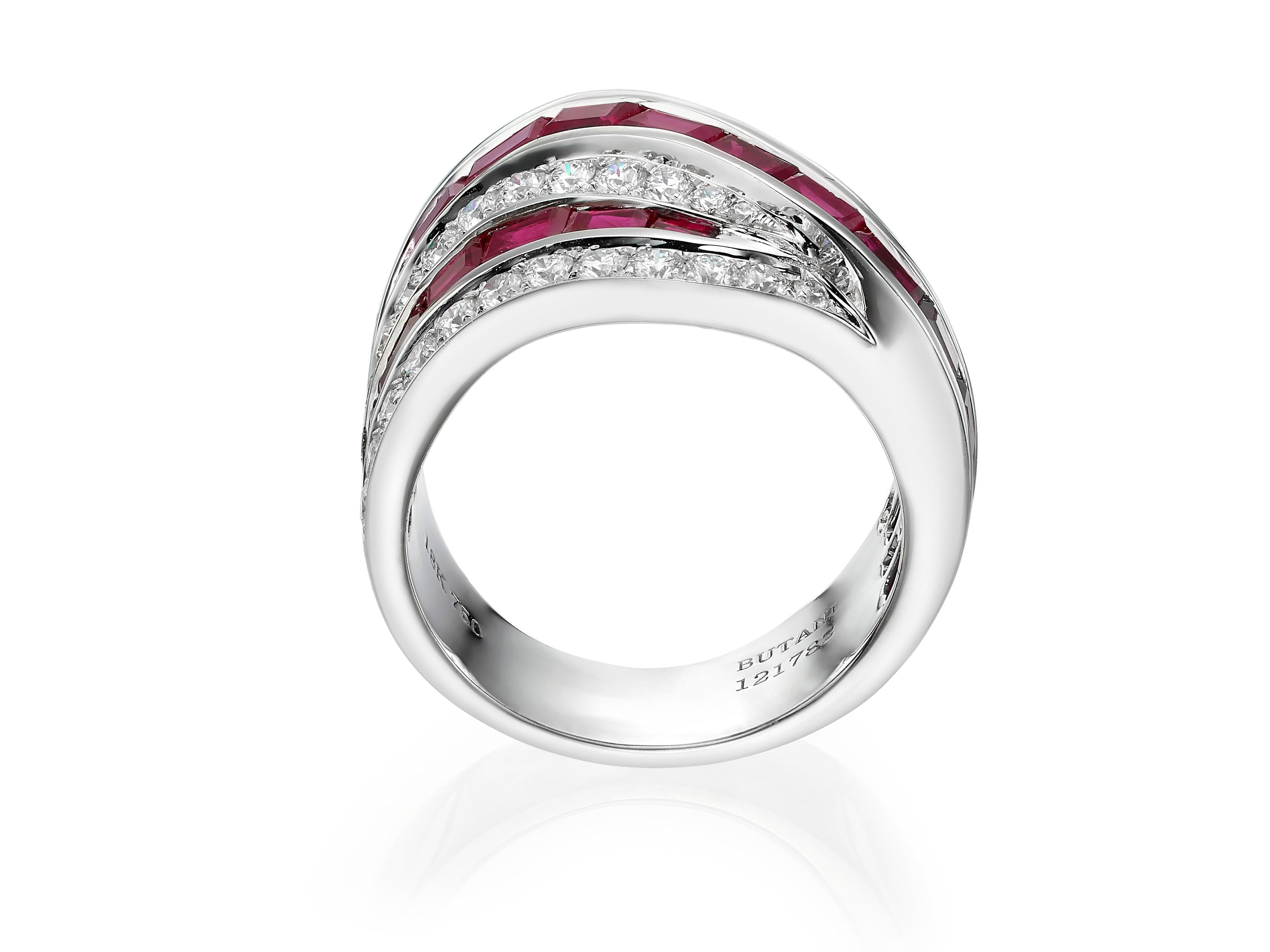 A beautifully crafted band cocktail ring with 5.63 carats of vivid red baguette rubies and round white diamonds.  Set in 18K white gold.  
Currently a ring size US 6 3/4.  For other sizes, please contact seller. 

Composition:
18K white gold
26