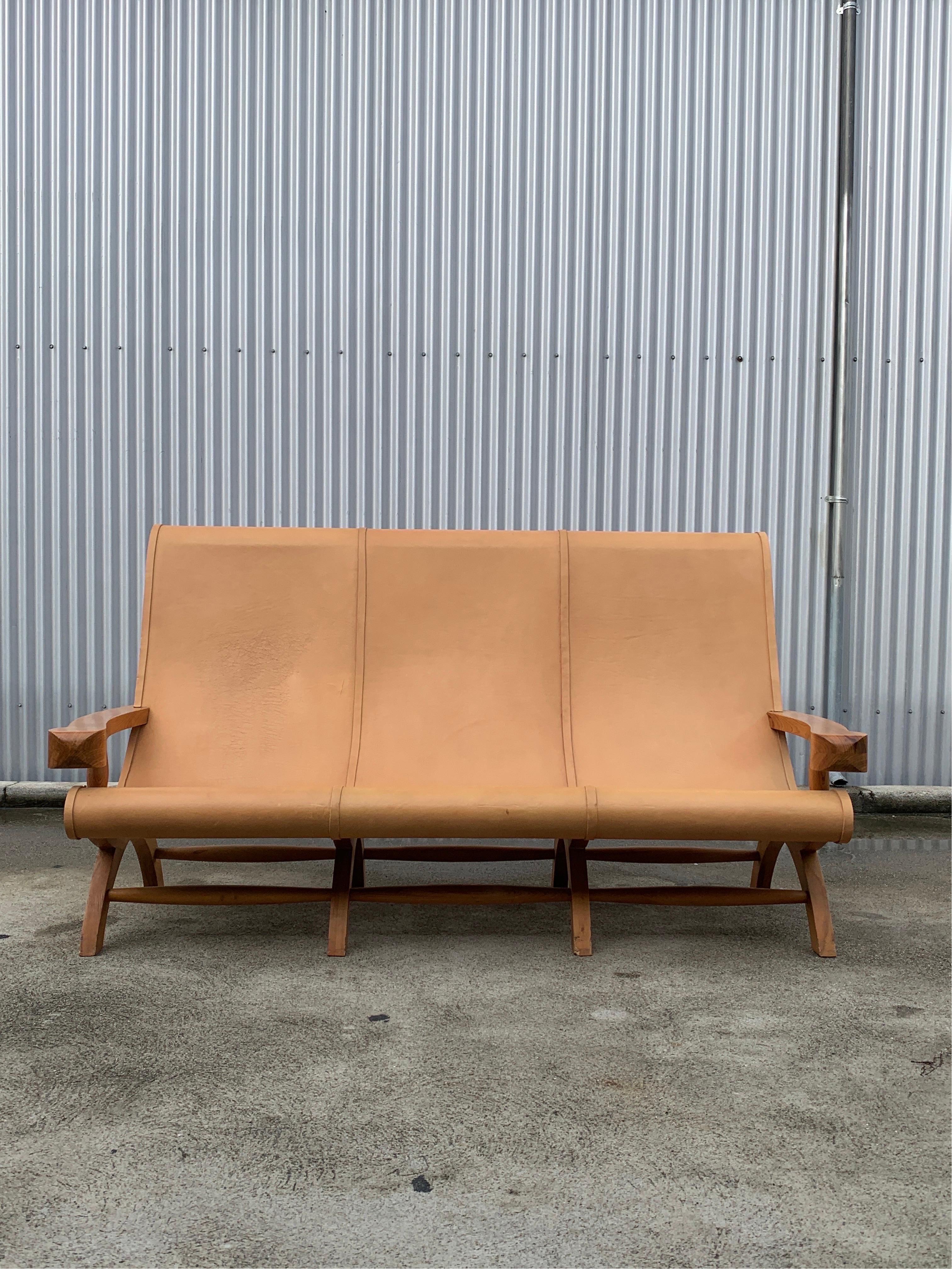 Clara Porset Butaque sofa from an important architectural masterpiece designed by Ricardo Legarreta in Emeryville California. Part of a reception suite featured prominently in the lobby of the Chiron building completed in 1999. Sofa is an iconic