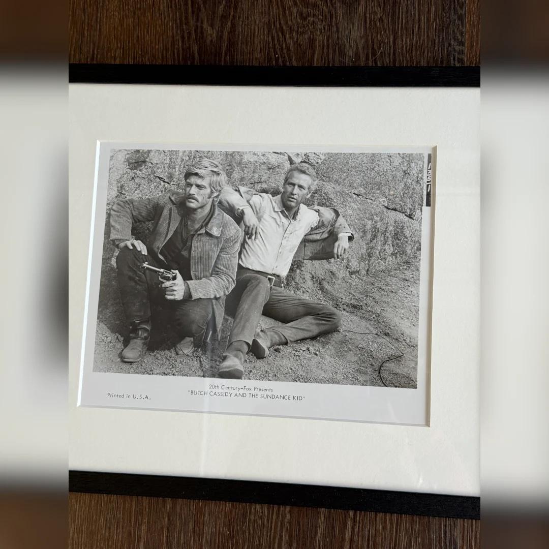 Butch Cassidy And The Sundance Kid (1969) - FRAMED
Photo Still (8 X 10 Inches)

Original 1969 20th Century Fox b&w publicity/photo still #135/51.

The photograph captures Paul Newman and Robert Redford in one of the film’s more introspective