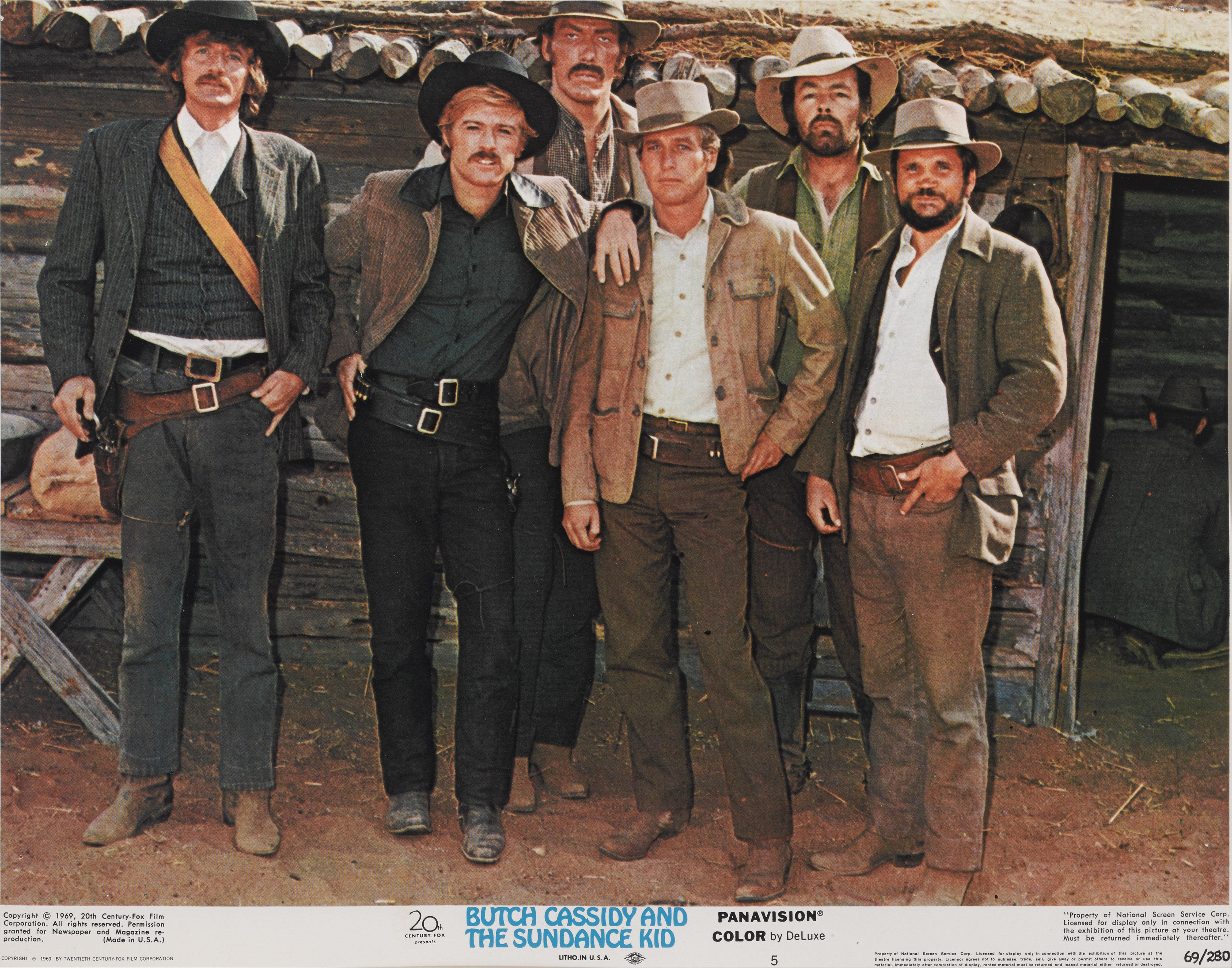 Original US lobby card for the 1969 classic western staring Paul Newman, Robert Redford, Katherine Ross.
This lobby card shows Butch and Sundance with the Hole-in-the-Wall Gang.
This film was directed by George Roy Hill.
This piece is framed in a