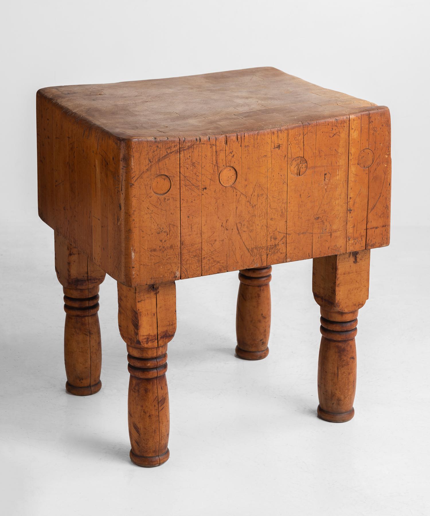 Butcher block, circa 1930.

Handsome form with heavily used slab top on turned legs.