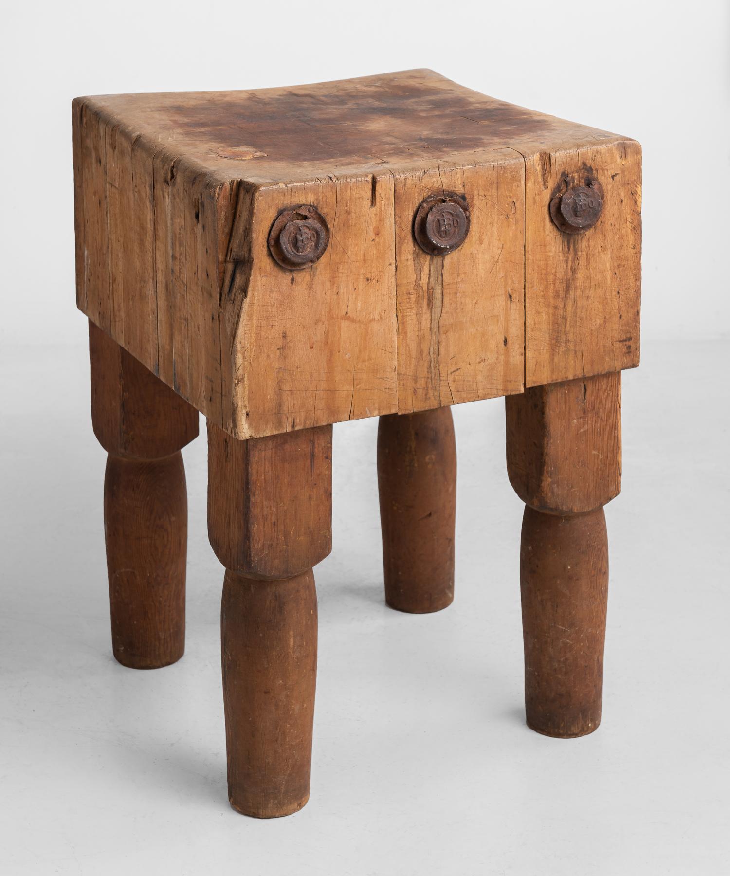 Butcher block table, America, circa 1930.

Simple form, with original patina and large metal rivets. Maple top with thick pine legs.

Measures: 20.5