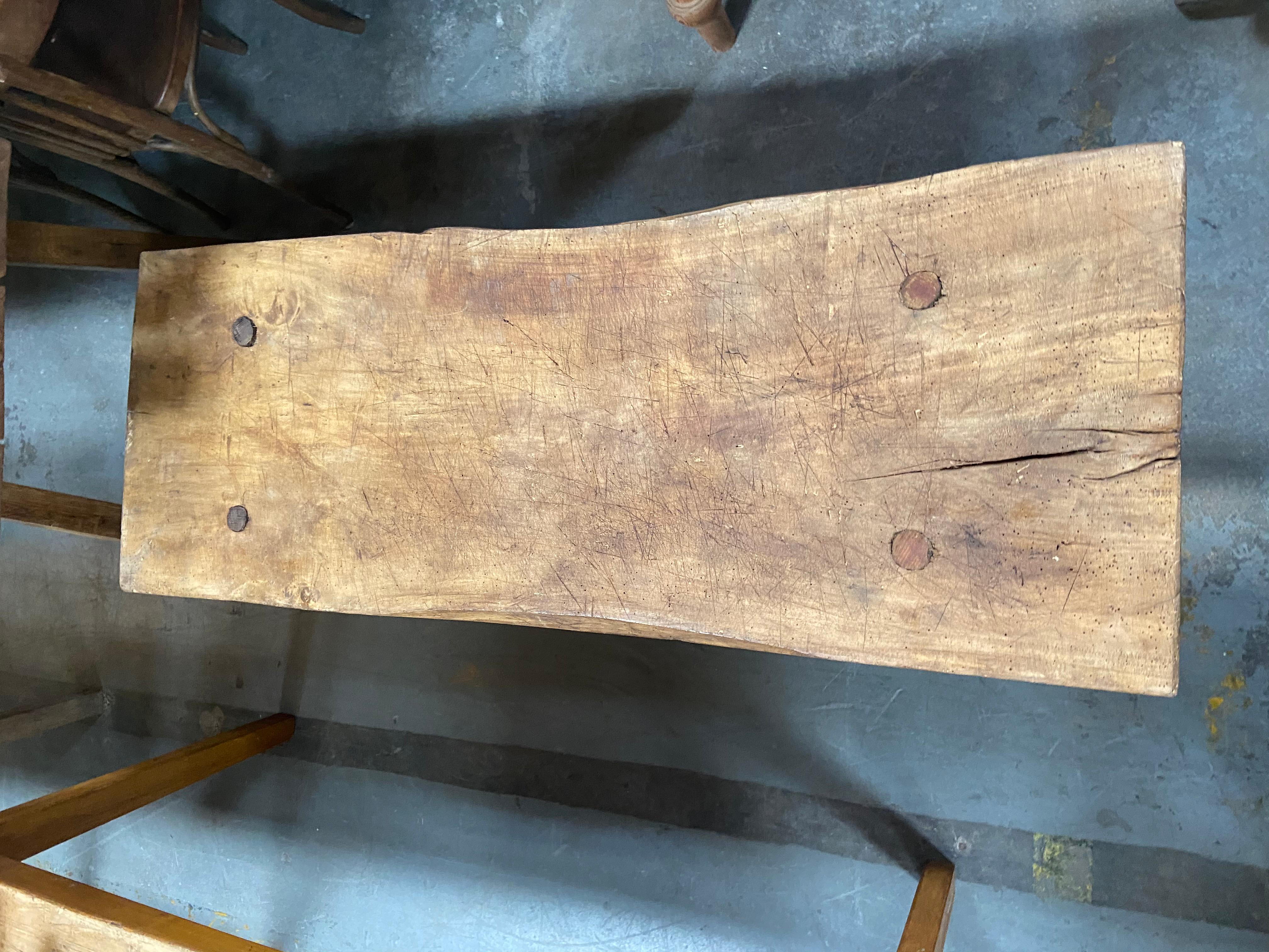This incredible vintage butcher block coffee table from Europe has a wonderfully well-worn aged patina, solid craftsmanship, and a unique character that would compliment any space.