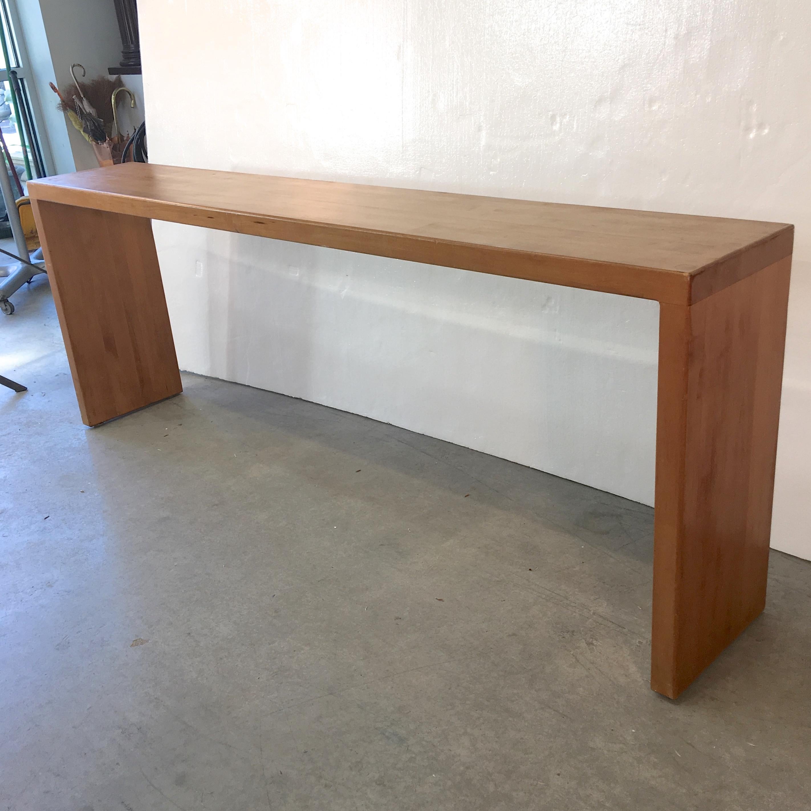 Edge grain hard maple butcher block parsons style console or sofa table built in the late 1970's by Shilling Architectural Millwork of Cambridge Massachusetts. Note the handsome peg construction where the slab legs join with the top. The scale of