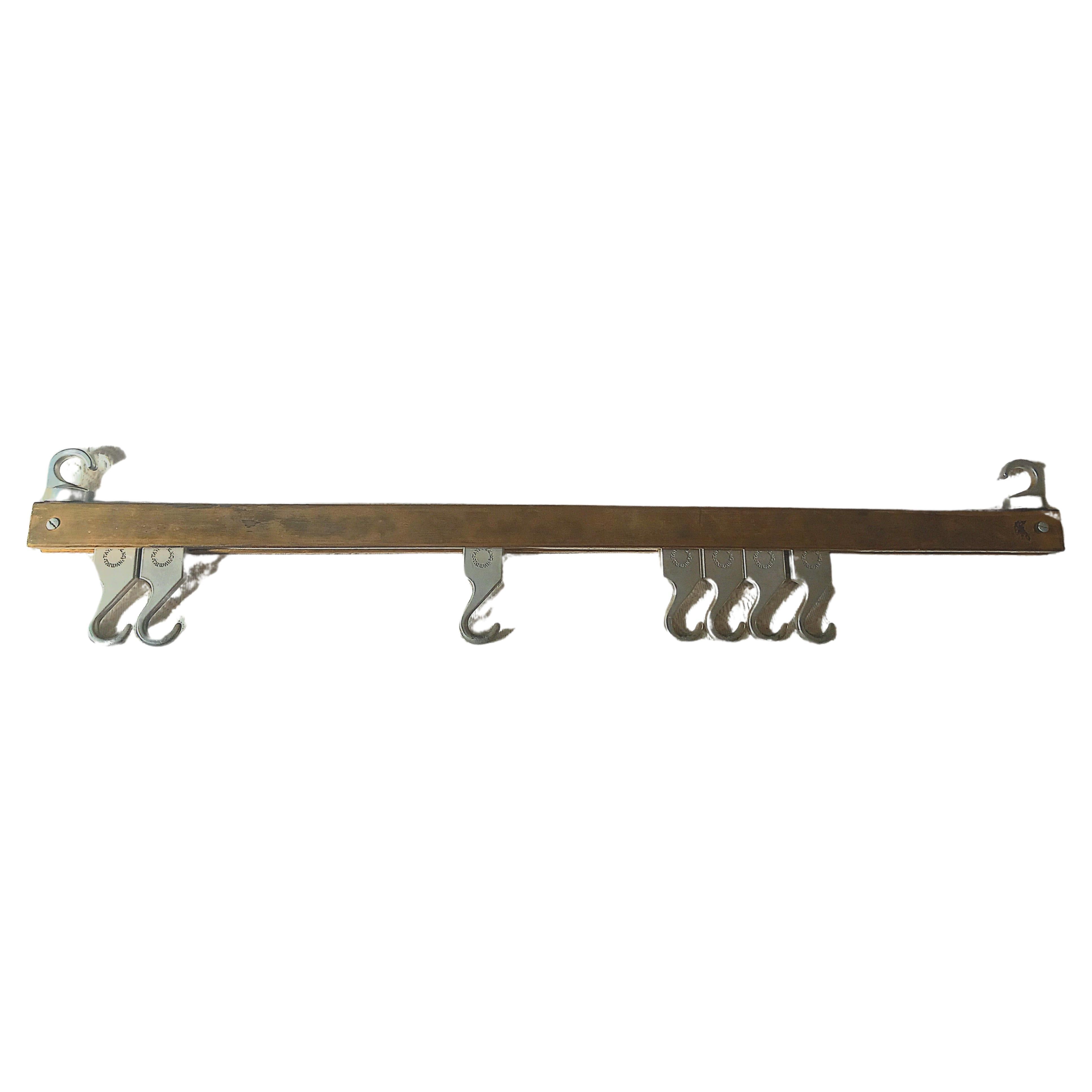 Unusual item-Uncommon
 Vey Industrial  butcher hook or hanger.
It is made of brass and steel and has several hooks.
It is a very decorative piece for the kitchen. It can be hung on the wall or from the ceiling.
Ideal for hanging pots or kitchen