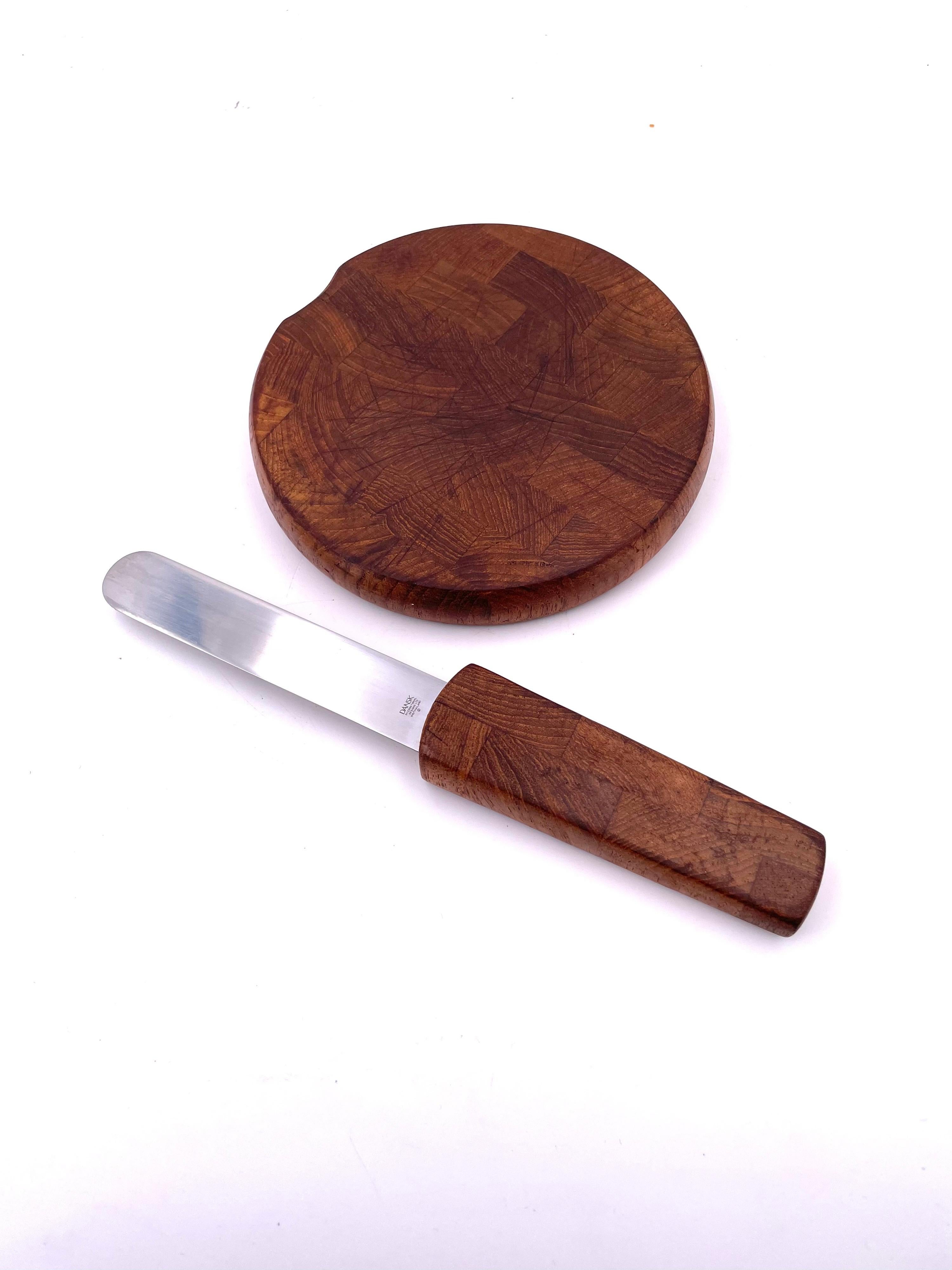 Simple design versatile and practical portable Dansk cheese and crackers butcherblock tray, in solid teak with knife, circa 1980's. the knife hides inside the tray.