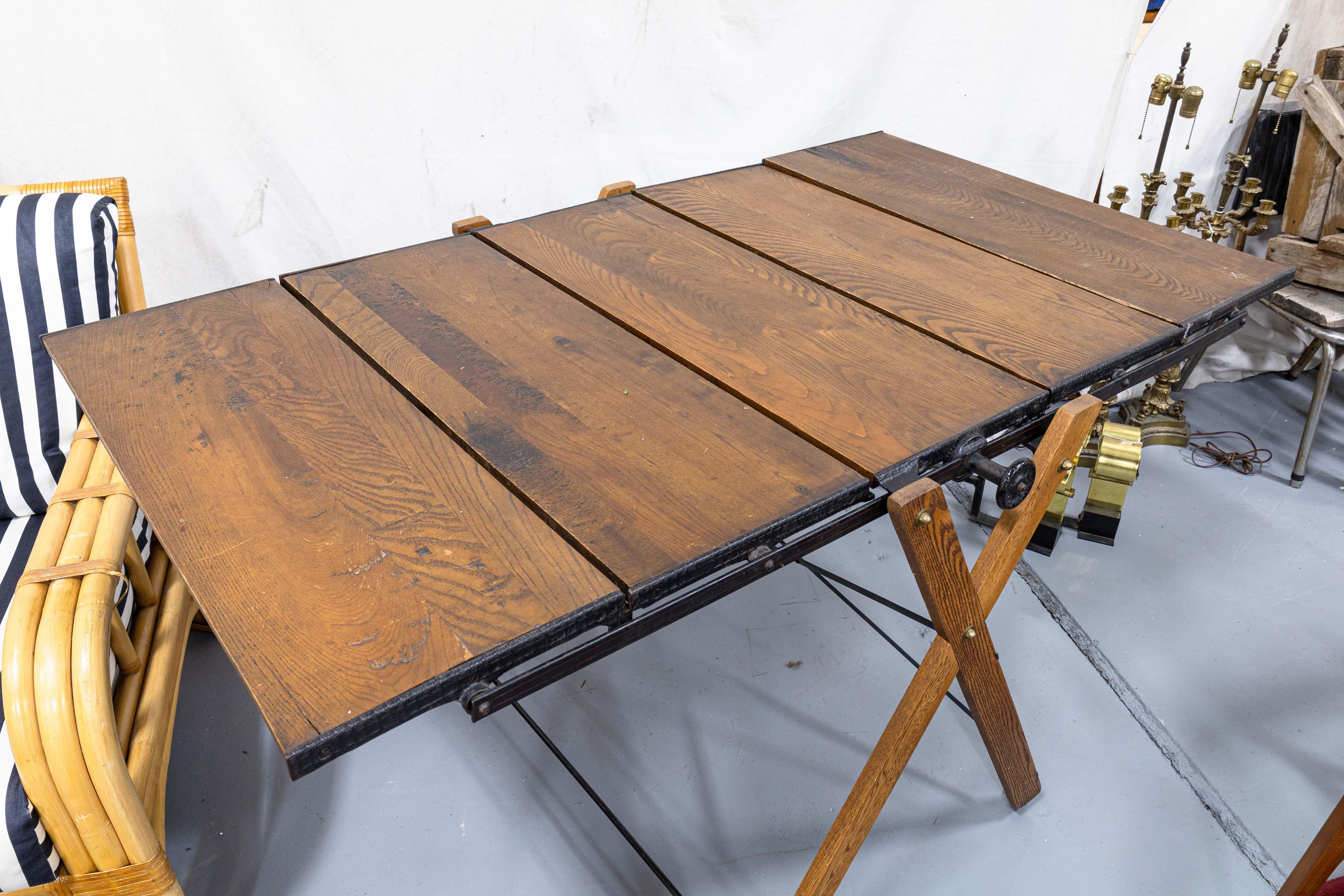 A Butler Brothers combined shelving display and table. This wonderful, unique piece features a fully form changing design. This piece can be a standard style dining table, an upright shelving display, and many things in between. Thanks to the