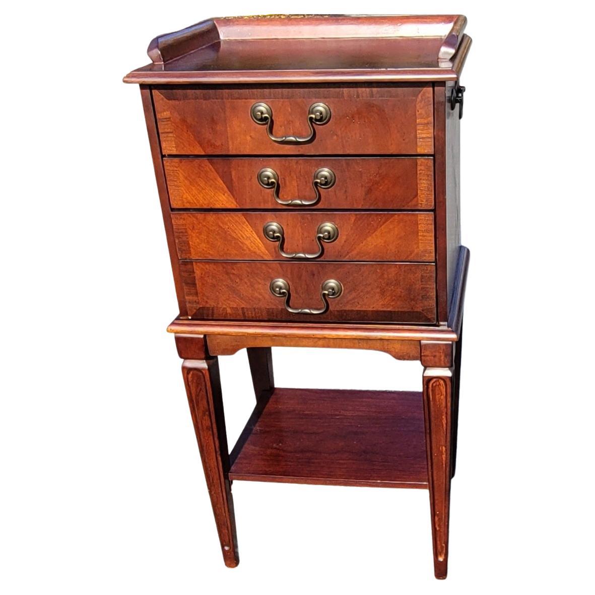 Ideal for storing dinnerware keepsakes, this silverware chest is beautiful and practical. Made of selected cherry hardwood and choice veneers, this chest boasts a Plantation Cherry finish. The bottom shelf allows you to display items, while the four