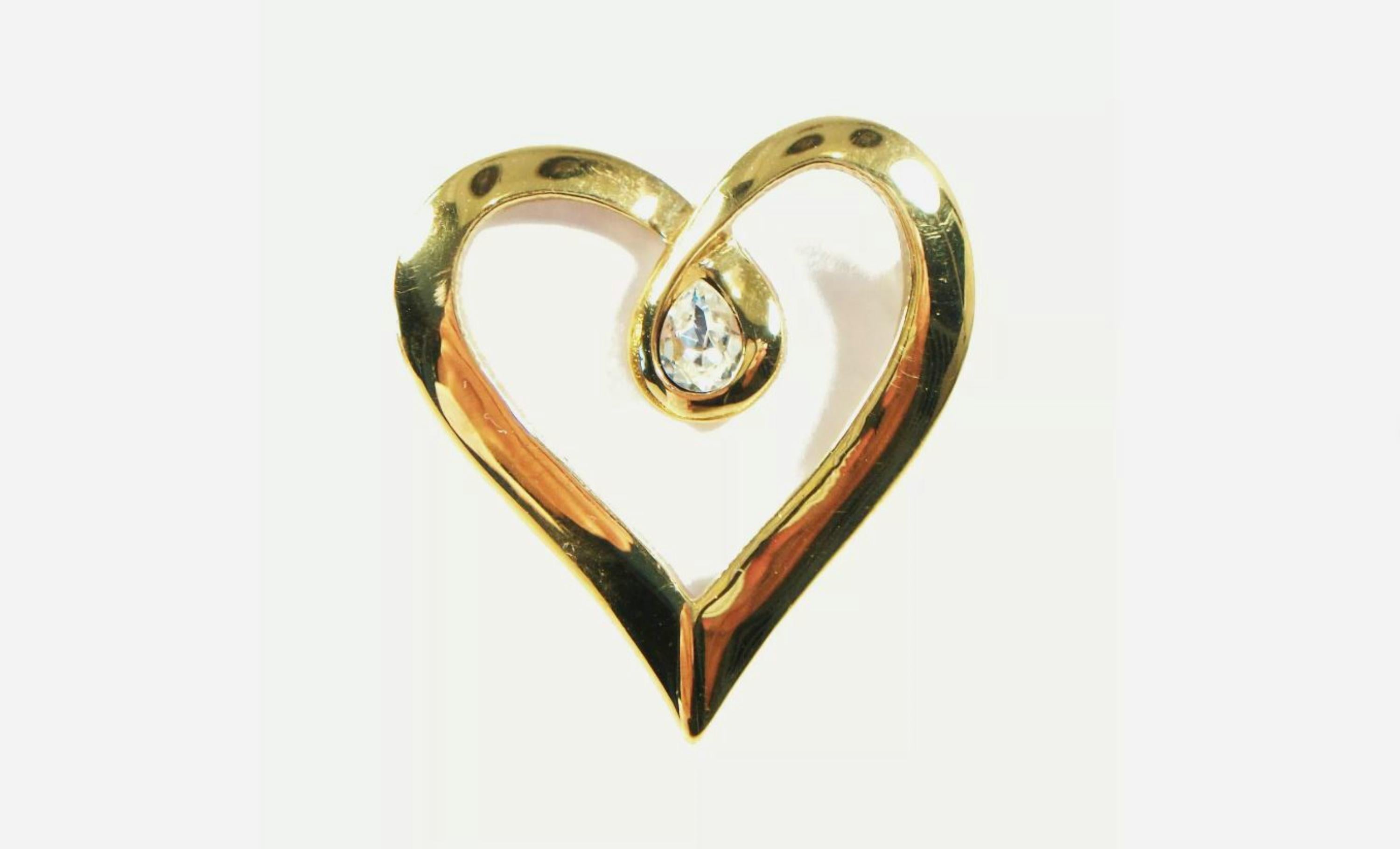 BUTLER - Vintage gold tone heart brooch - set with a single pear shaped rhinestone - hinged pin to the back - signed - circa 1980's.

Excellent vintage condition - no loss - no damage - no repairs - fine surface scratches from age and use - ready to