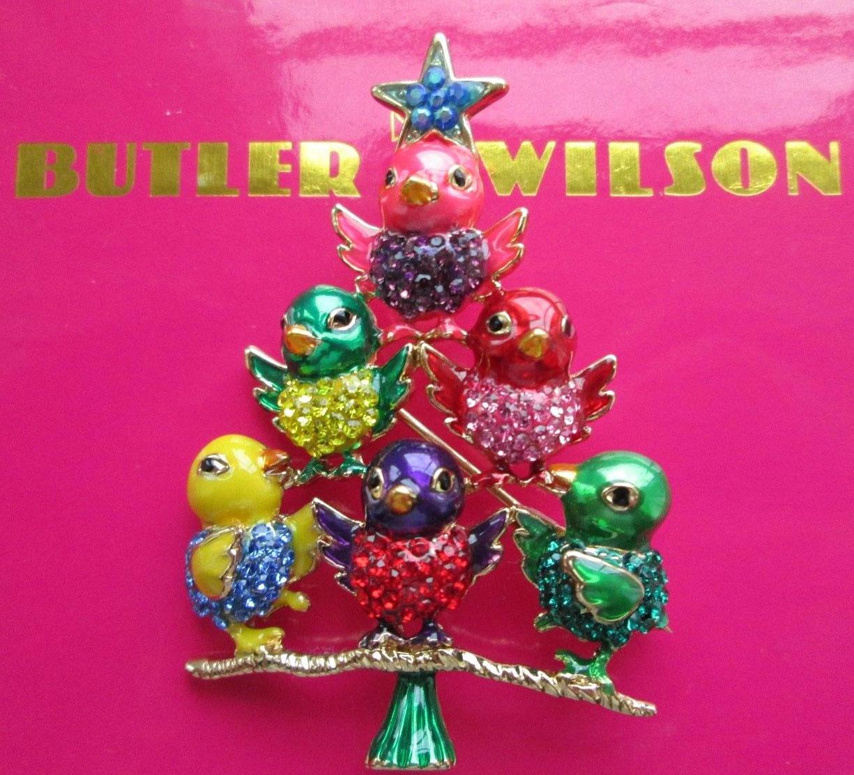 Delightful signed BUTLER & WILSON Bird Tree brooch featuring graduating rows of glossy enamel chicks in tones of pink emerald, red, yellow and purple, enhanced with sparkling faceted seed glass breasts in the same tones; gold tone petite beaks. Roll