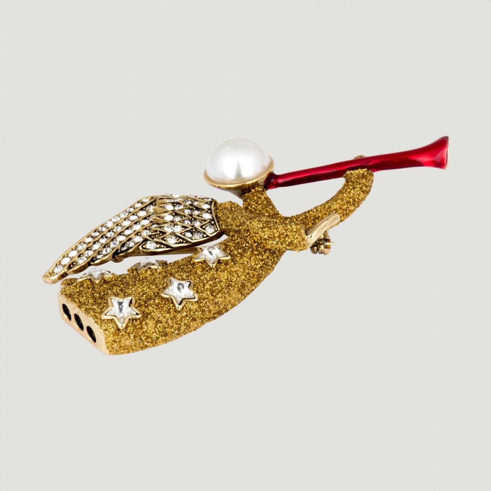 Beautiful Brooch featuring an Angel blowing a Horn; set with sparkling Faux Diamonds and Gold Glitter. Signed with a BW authenticity tag on the reverse; Measures approx. 8cm/3