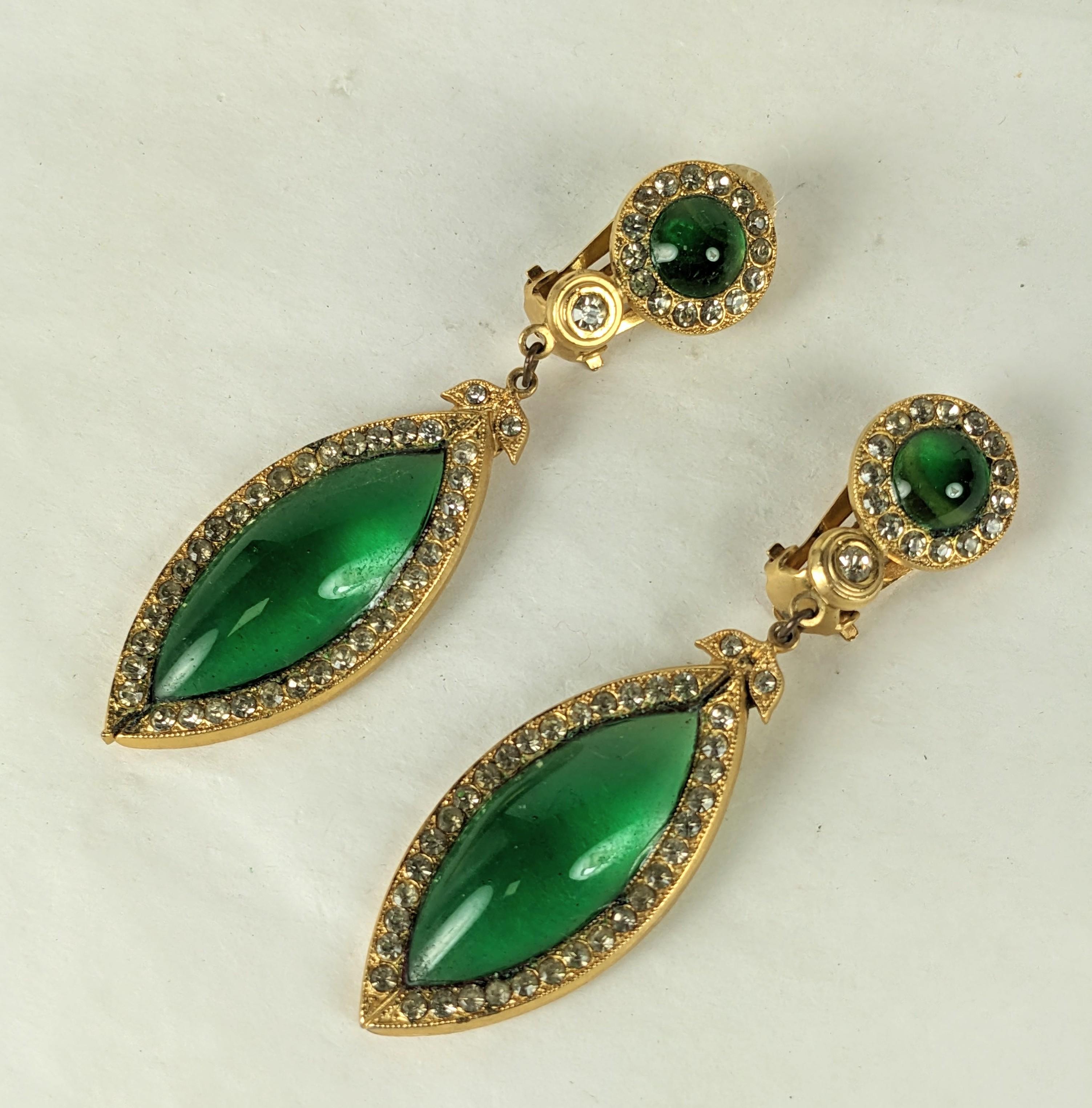 Butler Wilson Emerald Poured Glass Earrings made by Maison Gripoix in the 1980's. B+W commissioned Maison Gripoix to manufacture models for them for a short period. Gilt frames set with pave rhinestones with emerald hand poured glass.
France, Signed