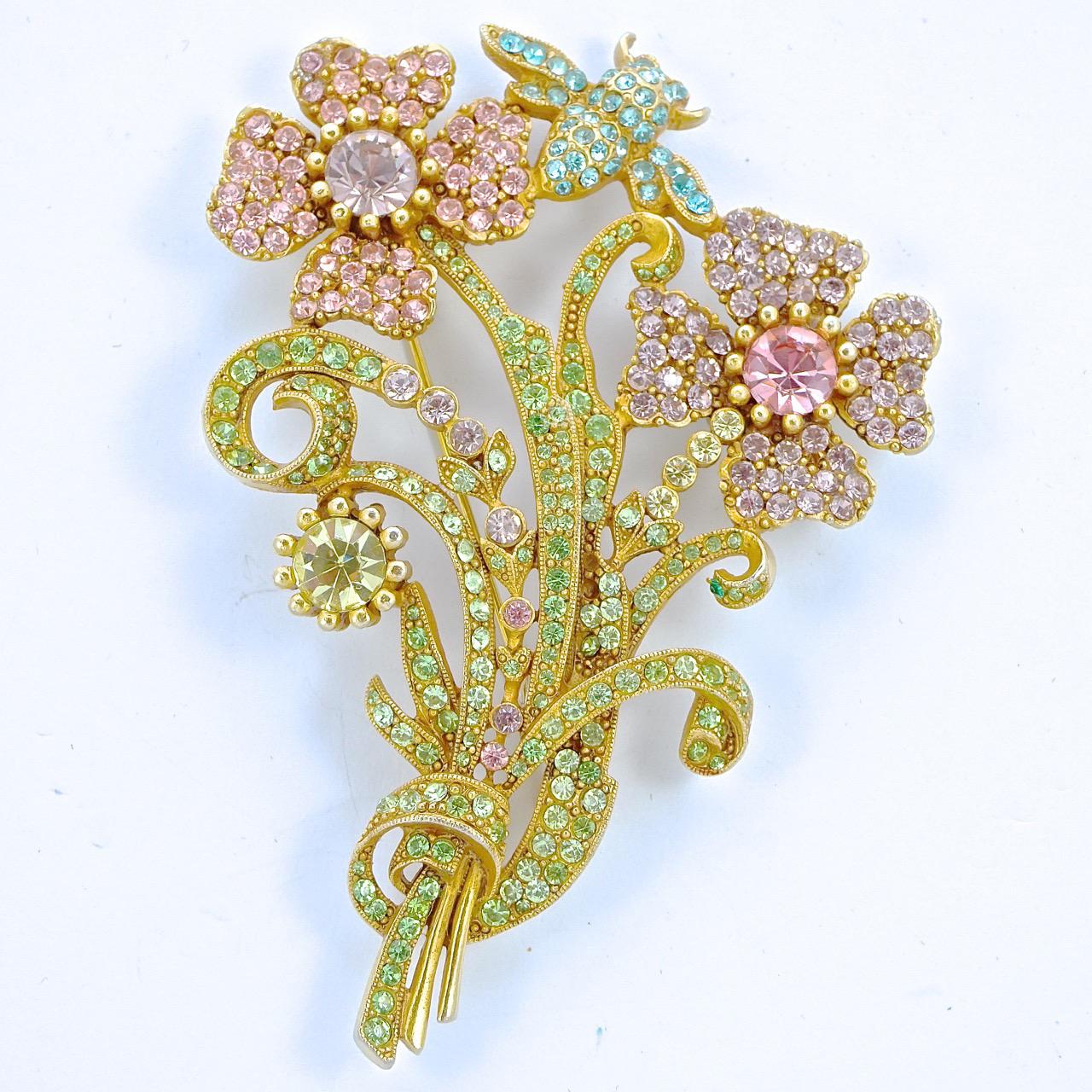 Fabulous vintage Butler & Wilson gold tone flower and bee brooch, and matching flower earrings. The brooch is set with sparkling crystals - lime green leaves, pale pink and pale lilac flowers, and aqua blue crystals for the bee. The brooch measures