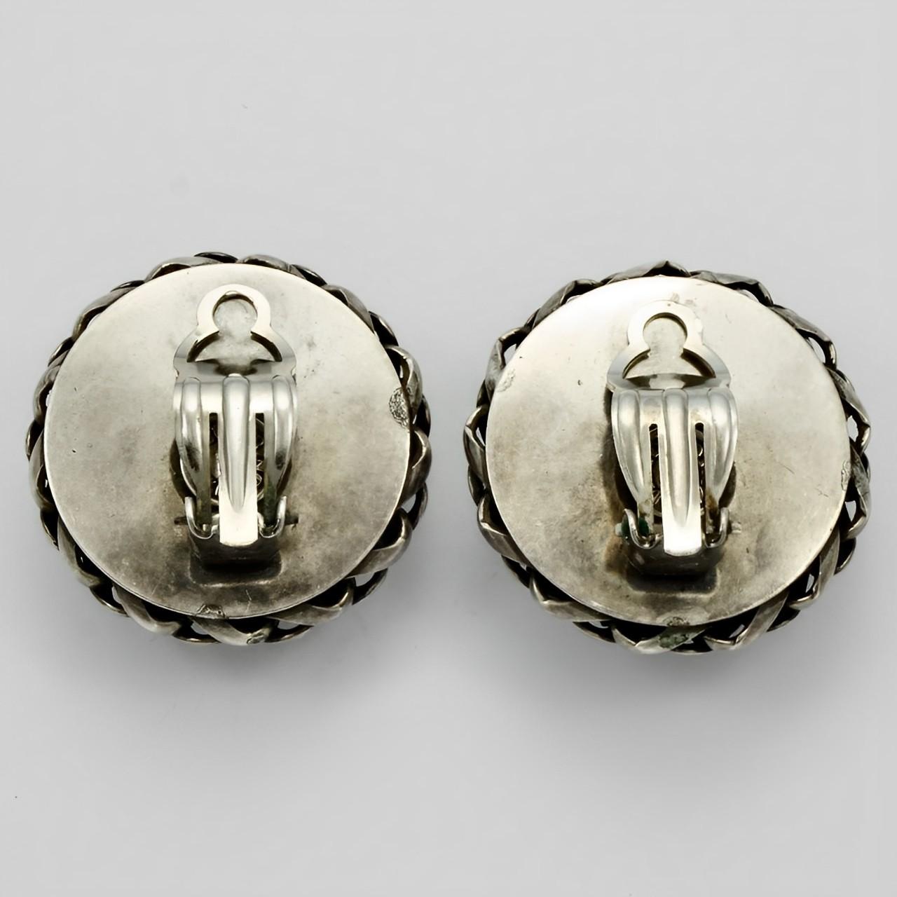 Wonderful Butler & Wilson silver tone earrings featuring a domed centre with mesh and twist edging. Measuring diameter 3.1 cm / 1.2 inches.

This is a lovely pair of ornate earrings, by London designers Butler & Wilson. Circa 1980s.

Nicky Butler