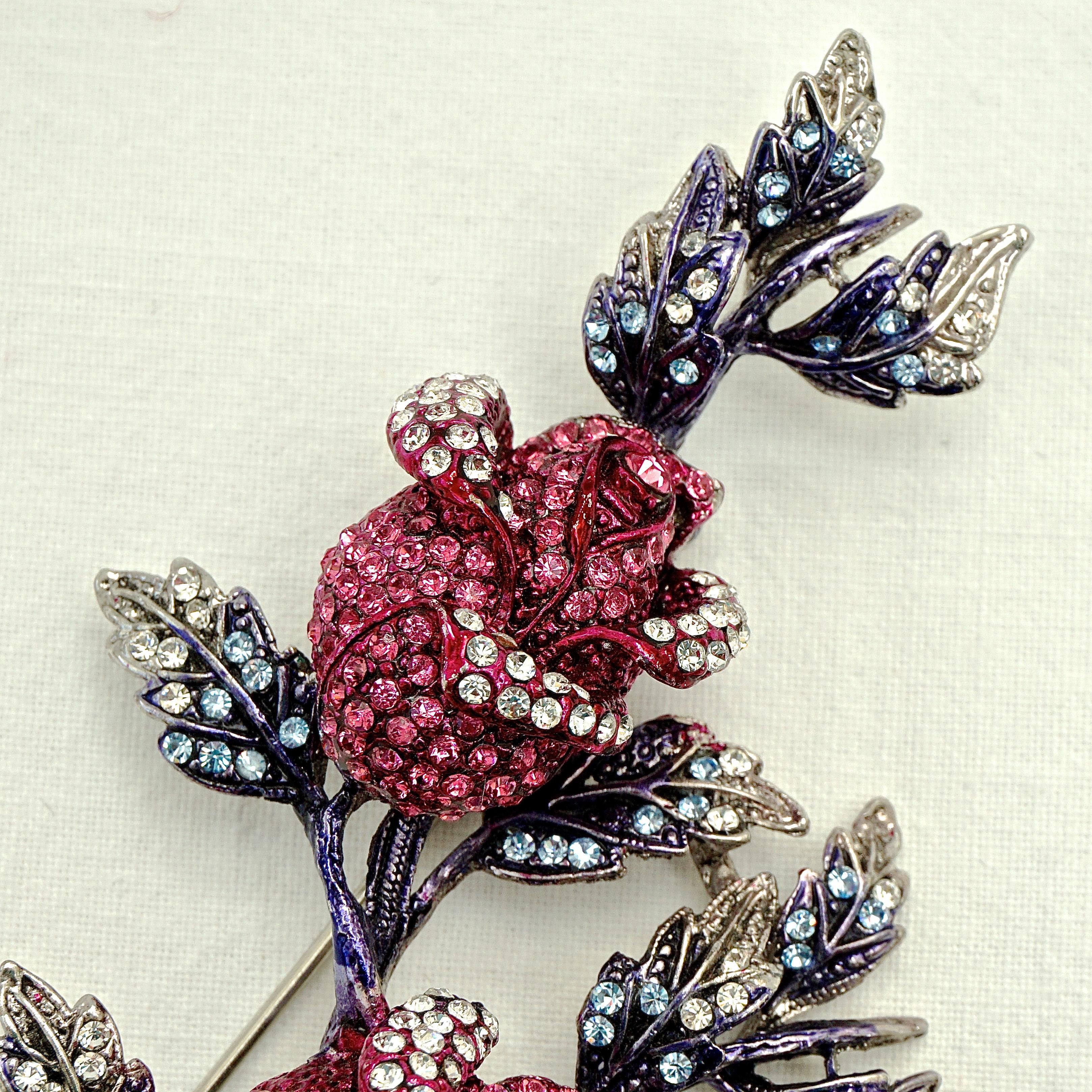 Fabulous large vintage Butler & Wilson silver tone rosebud brooch, with sparkling clear, pink and blue crystals. Circa 1980s. Measuring length 10.3cm / 4 inches by width 5.6cm / 2.2 inches. The brooch will arrive in its original Butler & Wilson pink