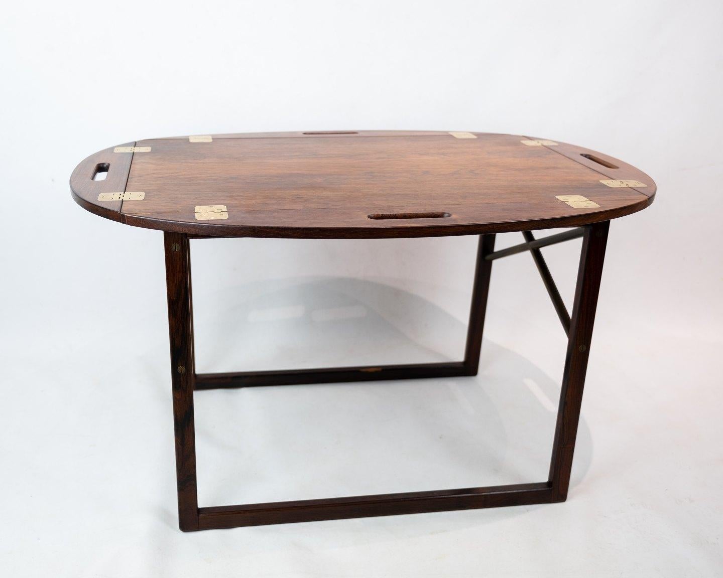 Butler's tray in rosewood designed by Svend Langkilde from the 1960s. The table is in great vintage condition.

 
