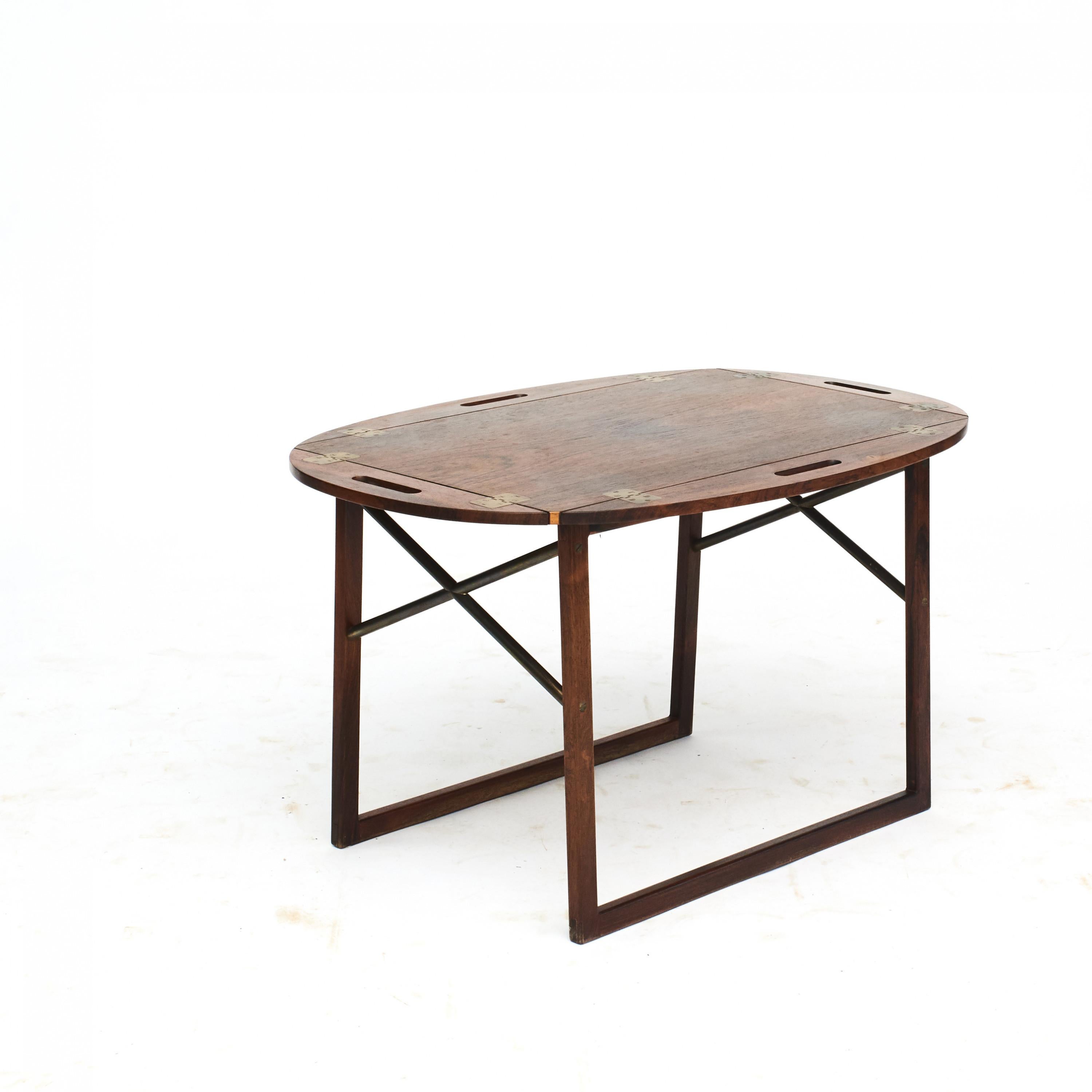Butler's tray in rosewood designed by Svend Langkilde.
Hinges and cross stretchers in brass.

Designed by Svend Langkilde, Denmark, c. 1965.
 