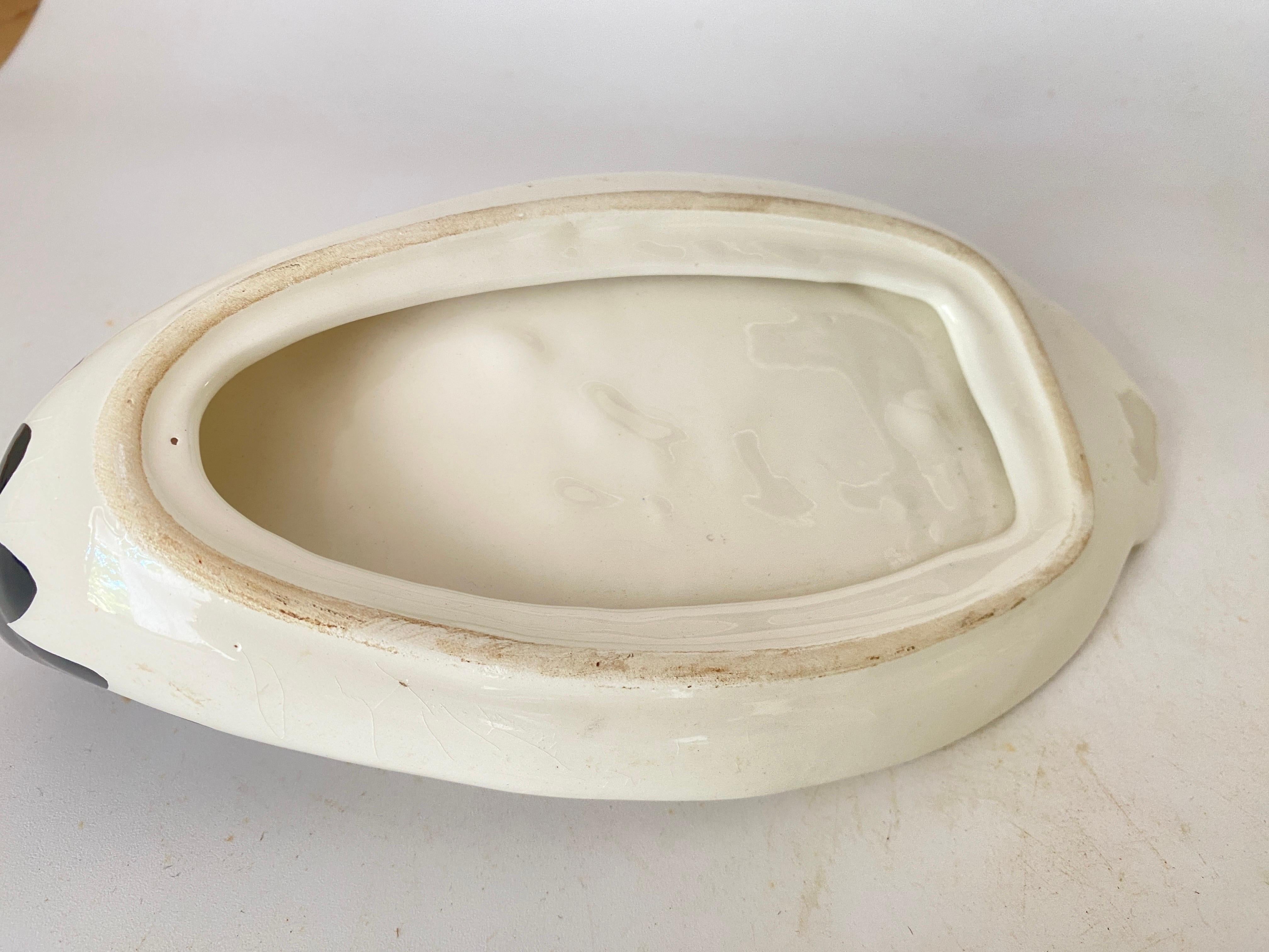 This Pair of  Butter dish is made of ceramic. Made in France in the 1970s. It is made of white a ceramic.
It can be used too, as FoisGras Dish.
Representing a duck.