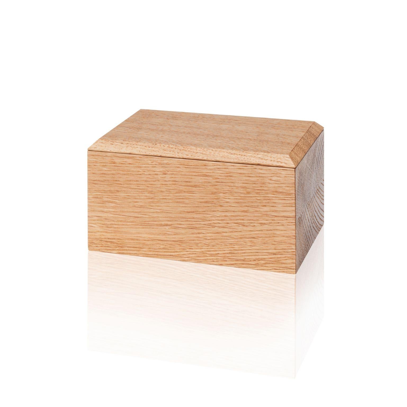 Butter Pino Boxes by Antrei Hartikainen
Materials: Oak, Natural Oil Wax
Dimensions: W 18 / 14, D 9, H 5 / 7cm

A set of three vertical and two horizontal stacking boxes constructed of vividly grained woods. The pino boxes may be arranged in various