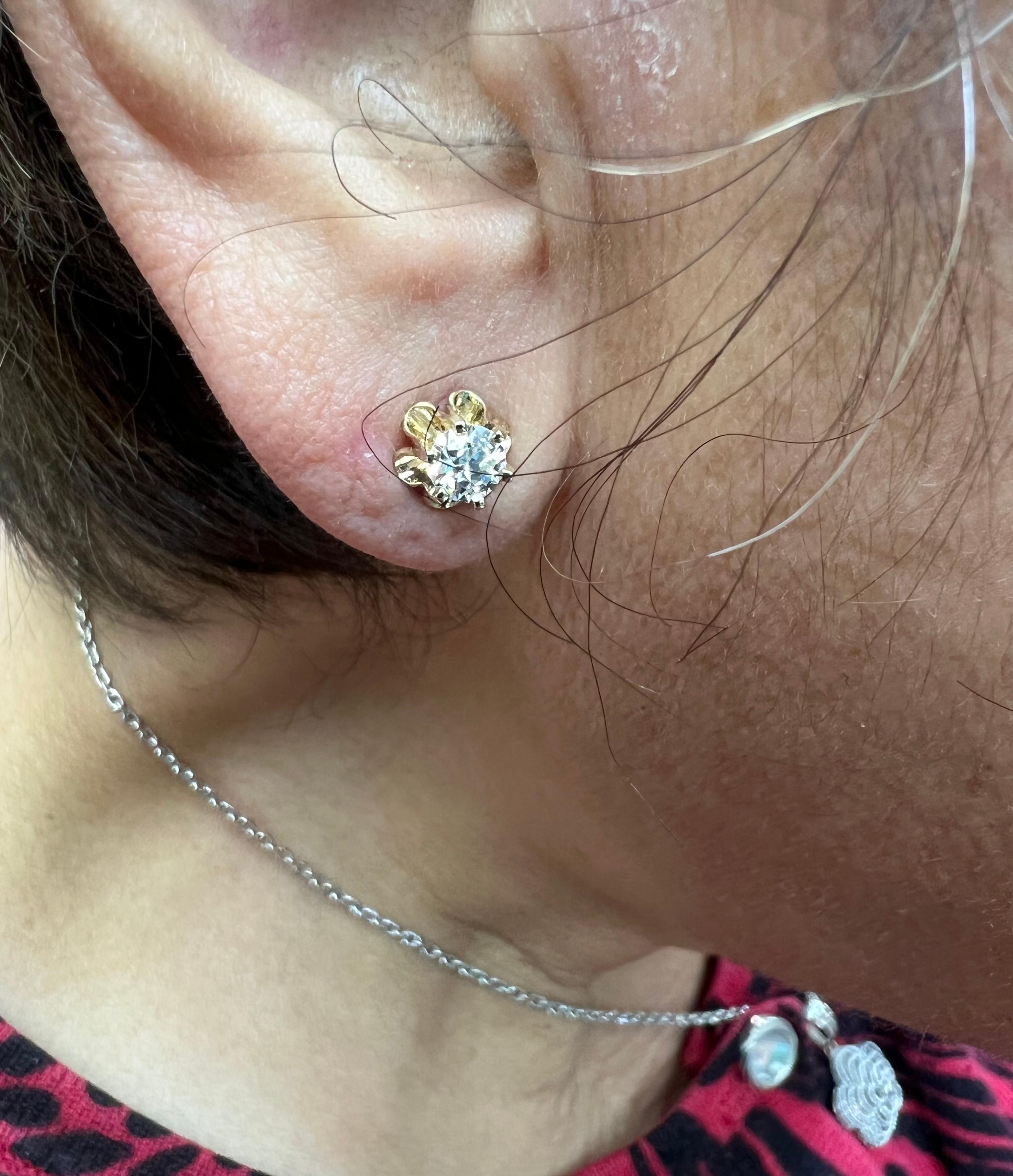 Buttercup Diamond stud earrings 14k yellow gold.

These Buttercup 14k yellow gold settings are set with 2 brilliant cut diamonds totaling 0.68 carats.  They are simple and elegant.  Earrings that can be worn all the time. 
 
SPECIFICATIONS:

