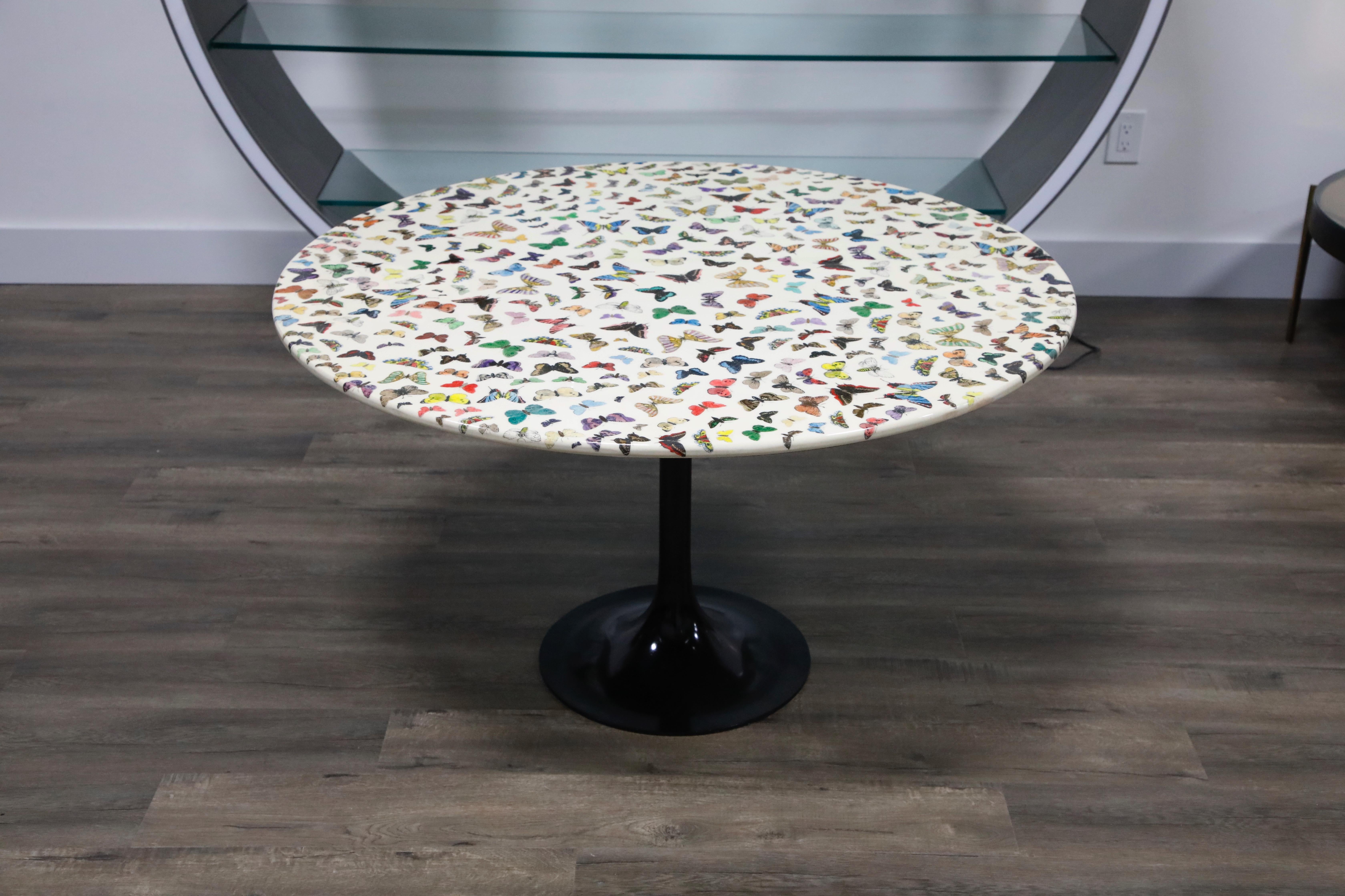 This pièce de résistance collectors item is the 'Farfalle' (translated to 'Butterflies') cafe dining table by Piero Fornasetti, circa 1960s, signed underneath with its original studio label. This round dining table (or center table) is made with