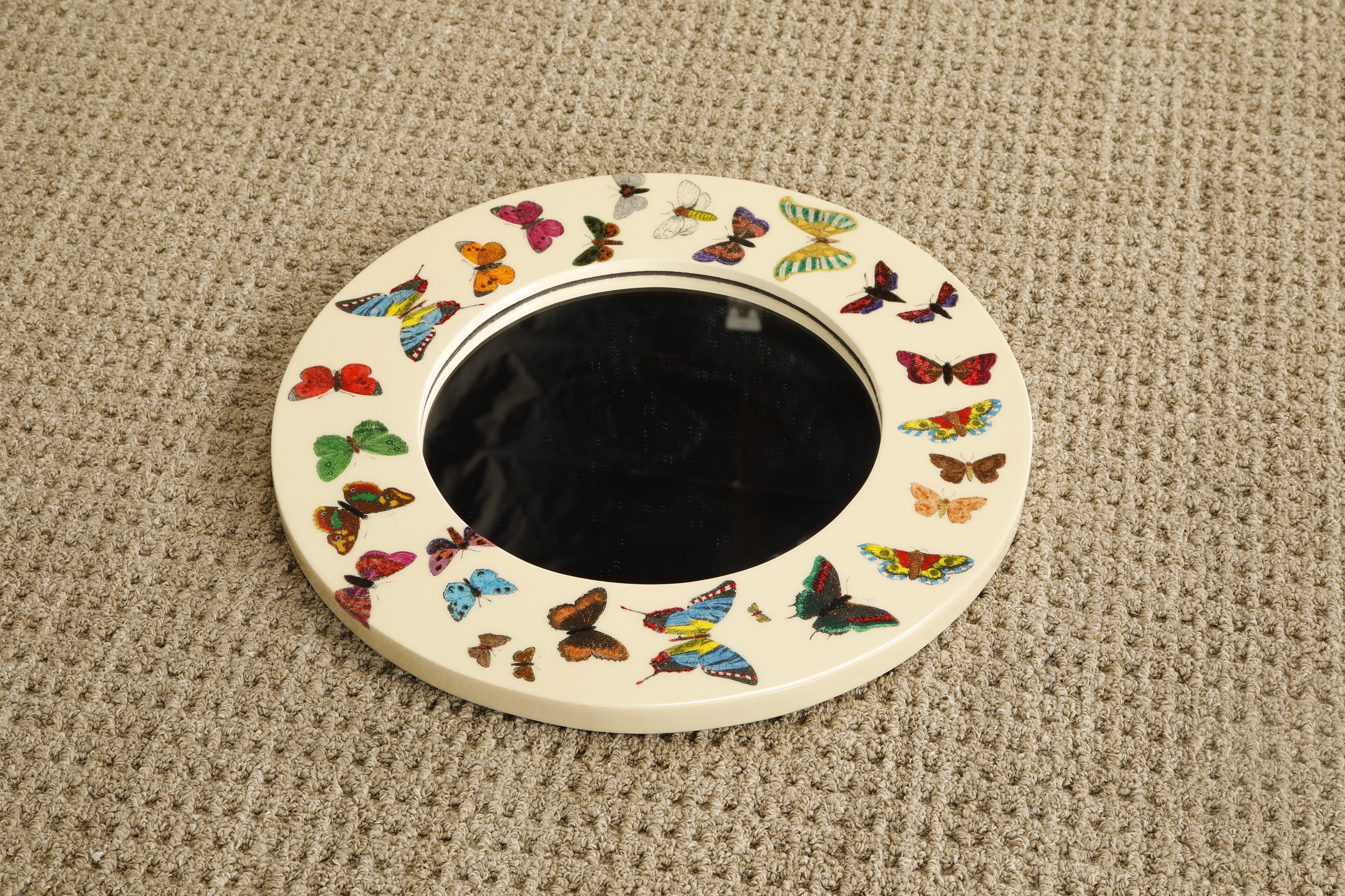 This is the 'Farfalle' (Butterflies in Italian) mirror by Piero Fornasetti, signed on the back with the Fornasetti label, is a gorgeous collectors piece ideal for the interior designer looking for the perfect unique splash of fun and intrigue. This