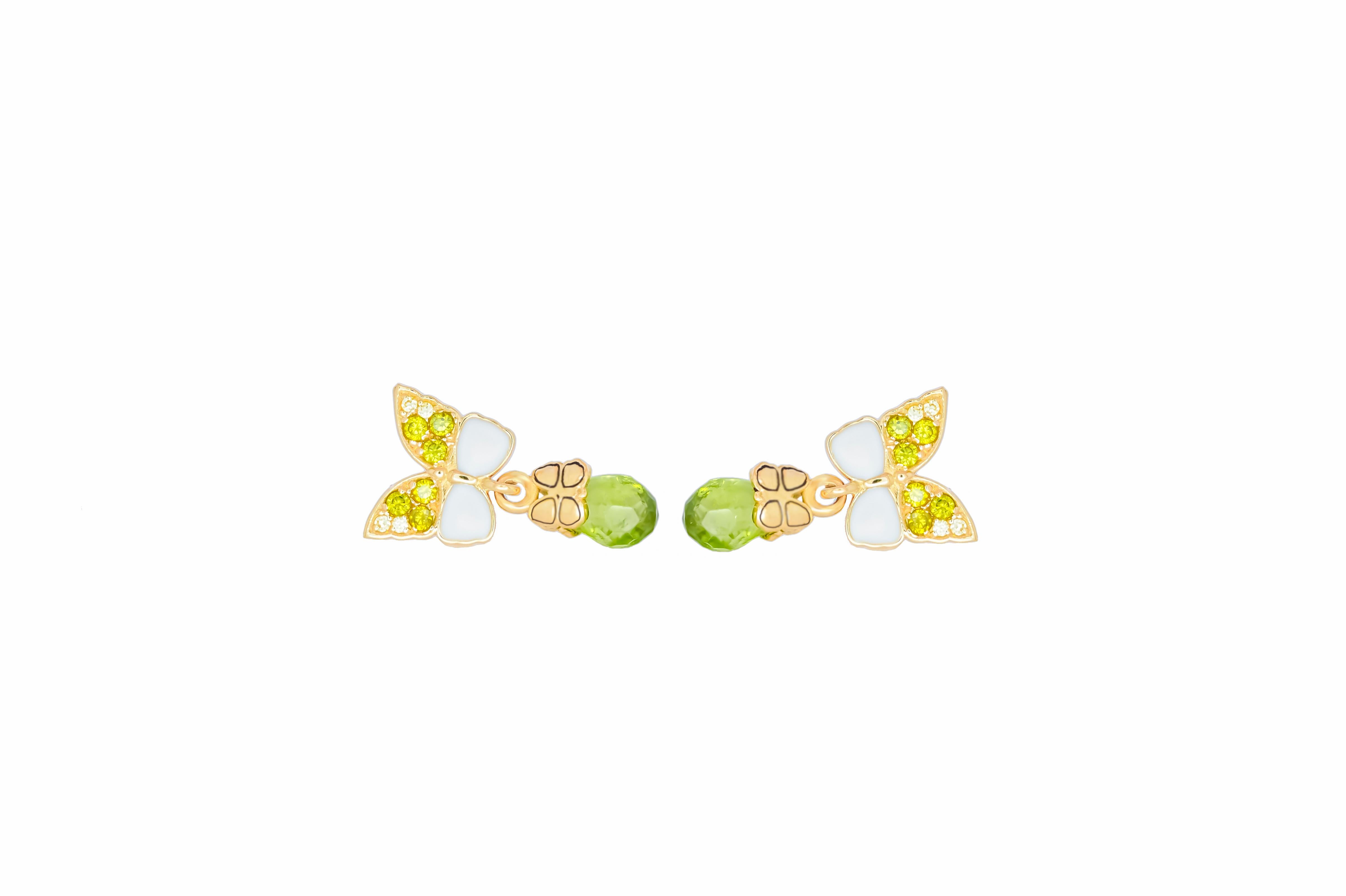 Butterfly 14k  gold earrings with peridot briolettes. 
Peridot Dangle Earrings for Women. Peridot Drop Earrings. Beautiful earrings for everyday wearing. 

Metal: 14 karat gold
Weight: 3  g.
Size:   19x10
Peridots 2 pieces - apple green color,